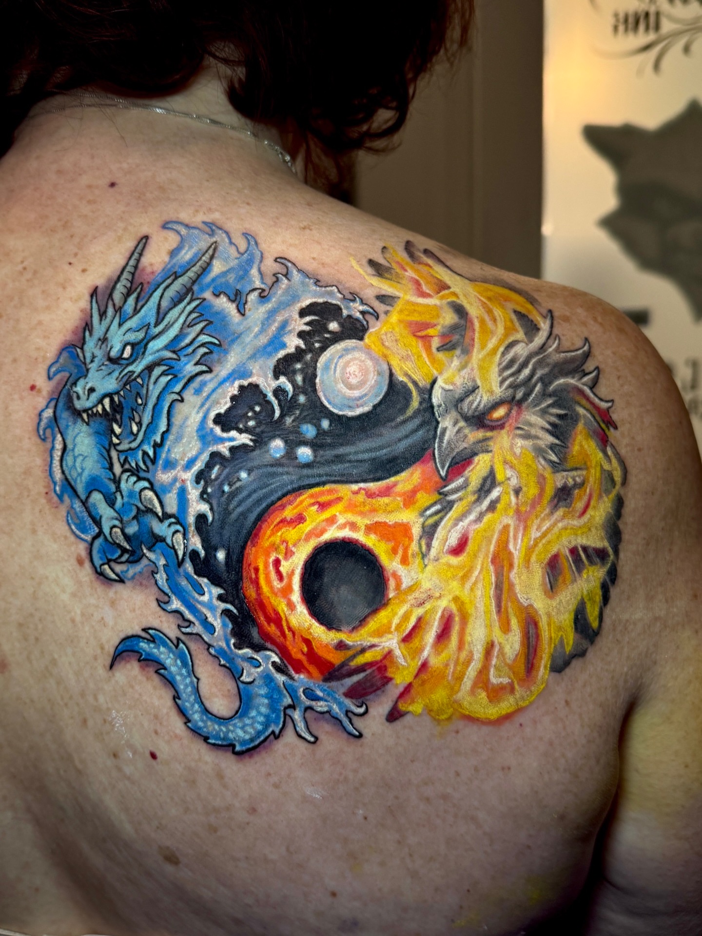 Yin yang new school tattoo on the back by Jarrod Gatzke