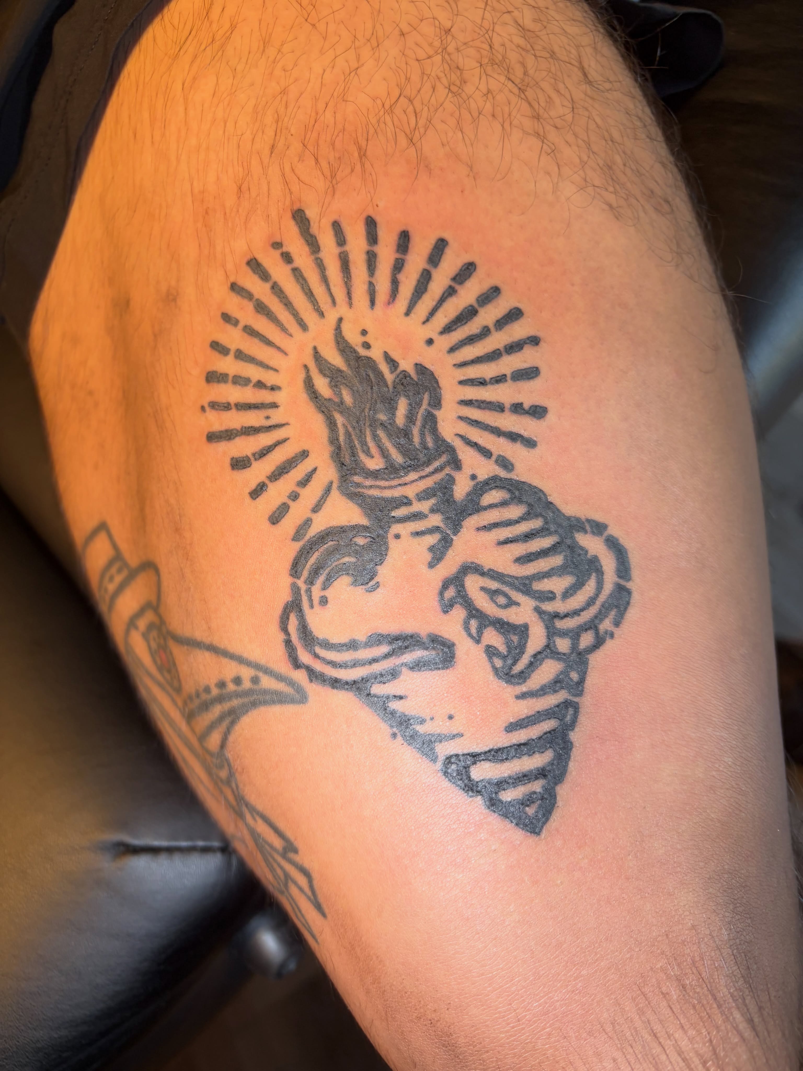 Flame heart black and grey tattoo on the thigh by Calen Copeland