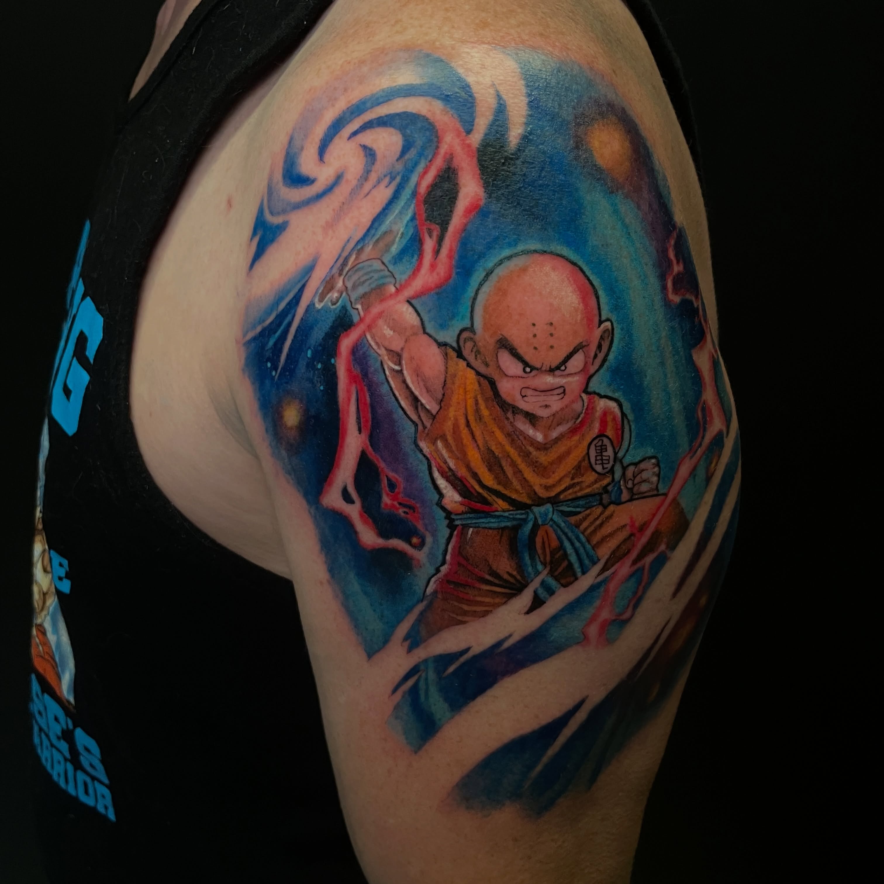 Krillin anime tattoo on the shoulder by Zachary Hayden