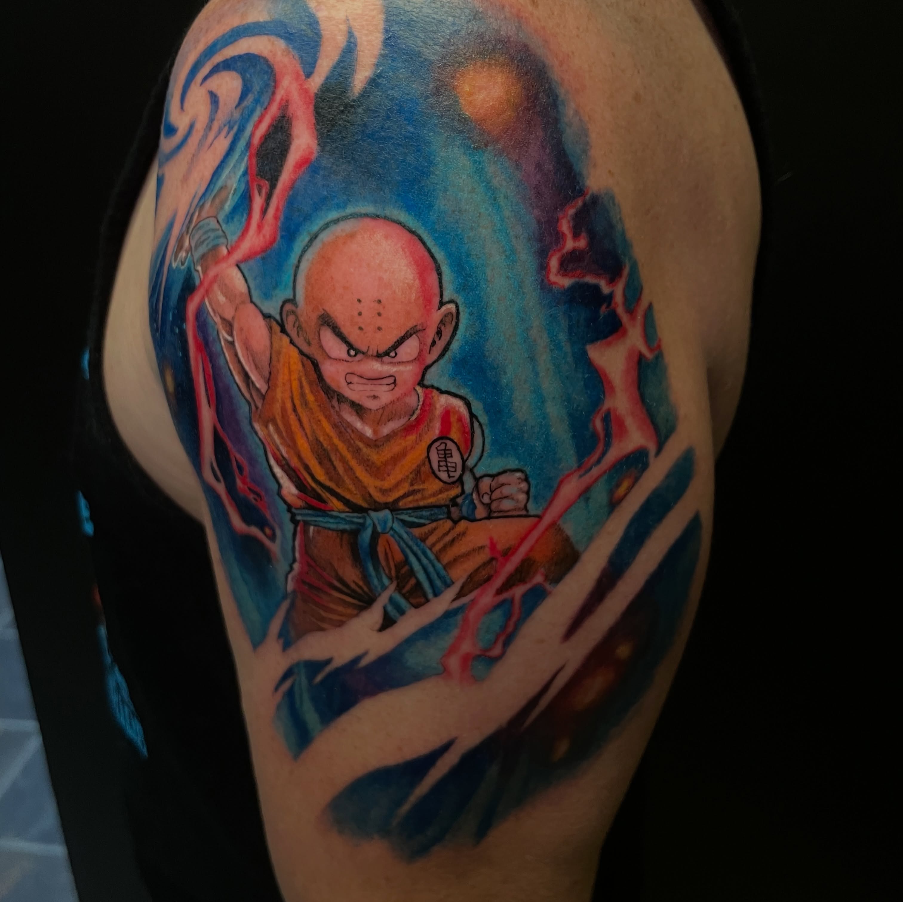 Krillin anime tattoo on the shoulder by Zachary Hayden
