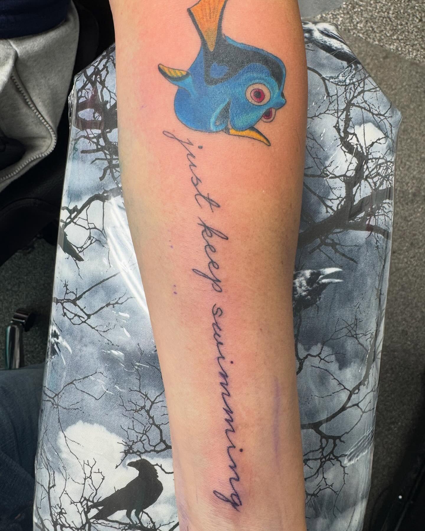 Just keep swimming new school tattoo on the forearm by Brazun Locker Poloschan