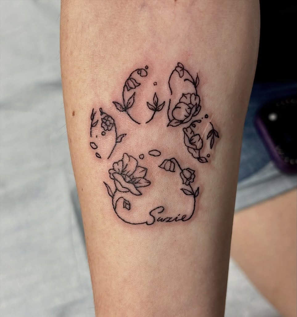 Paw print with flowers fine line tattoo on the forearm by ✮ ✄ star ✮ ✄