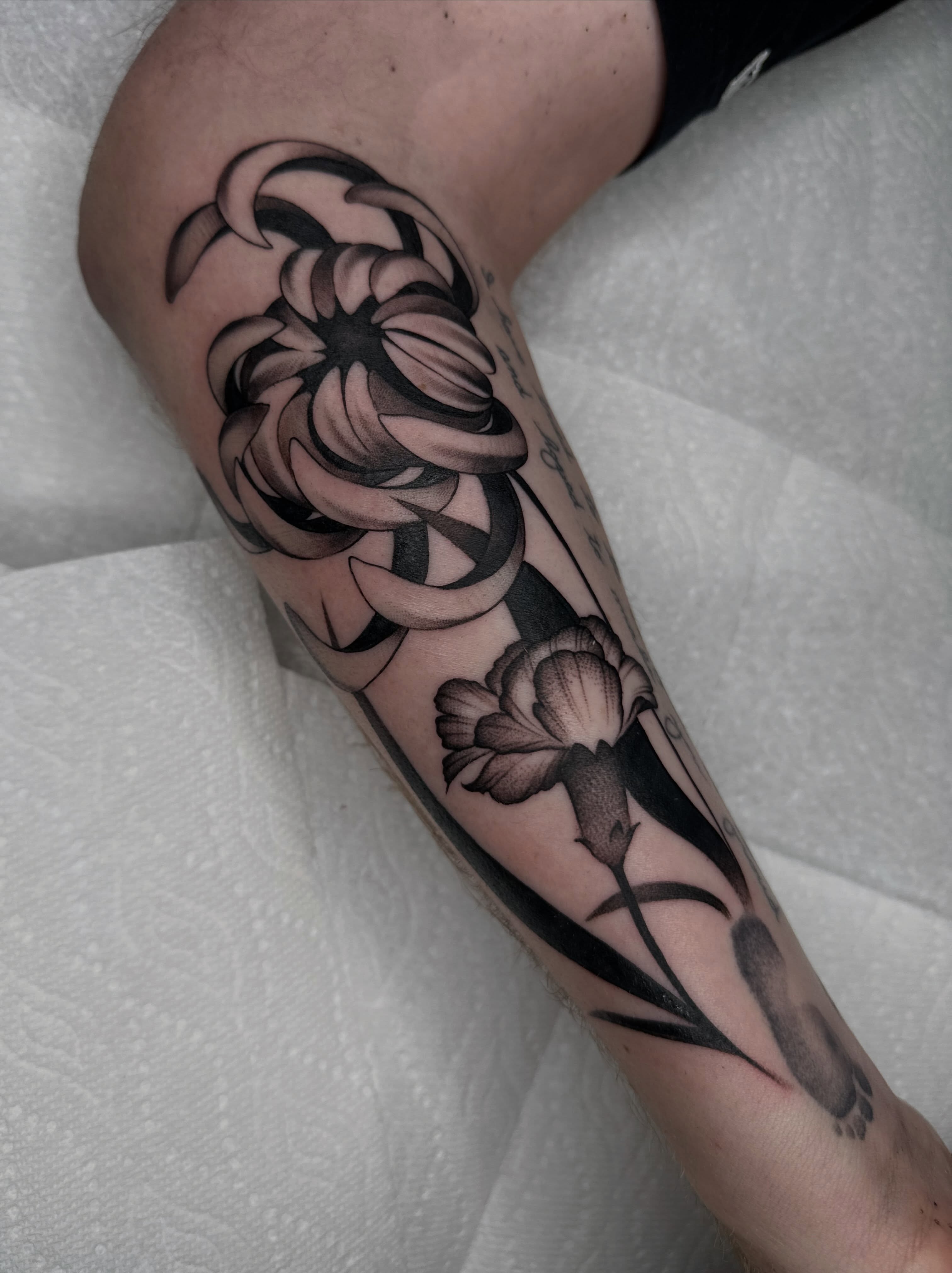 Flower black and grey tattoo on the forearm by Aleksandra