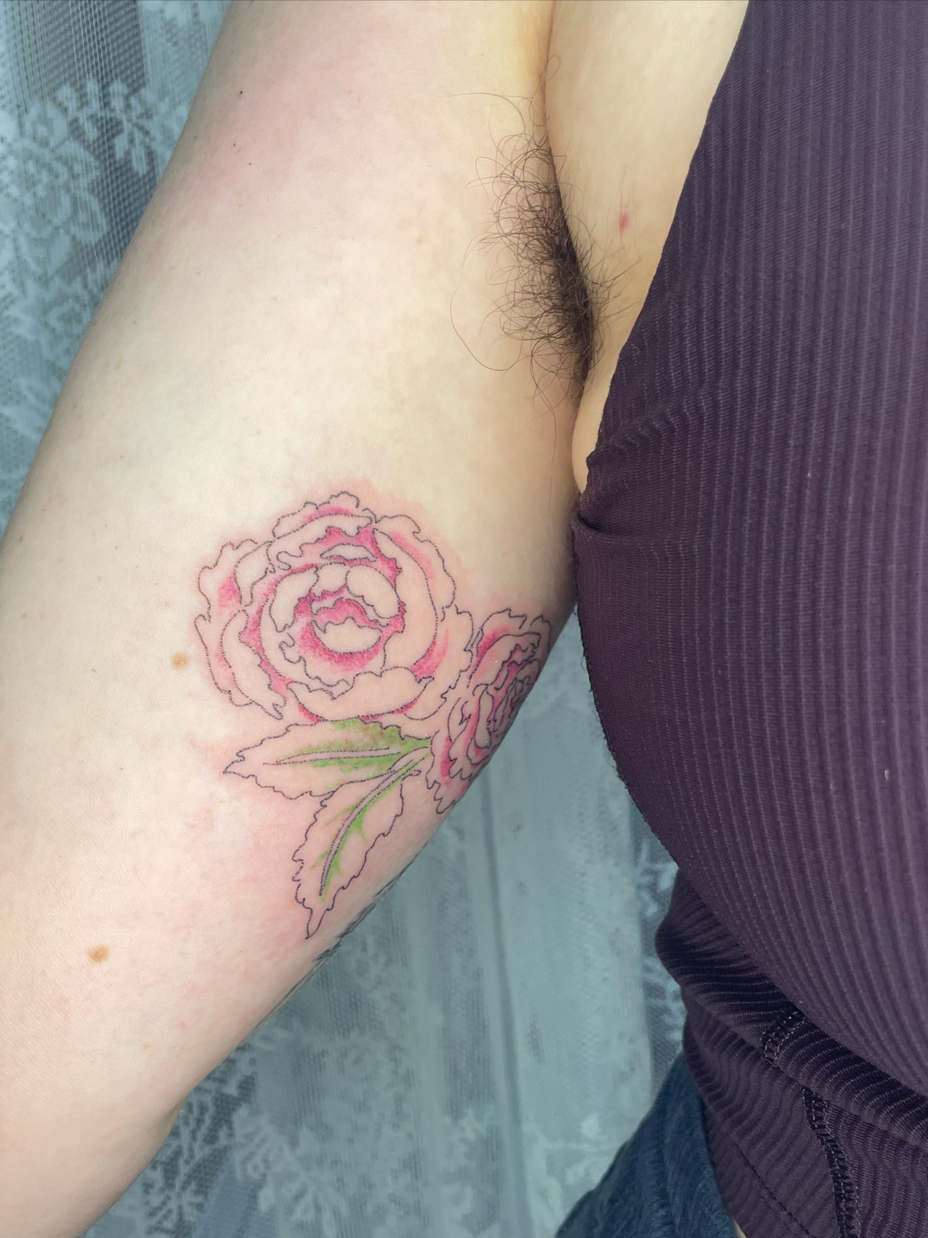 Rose new school tattoo on the forearm by cait