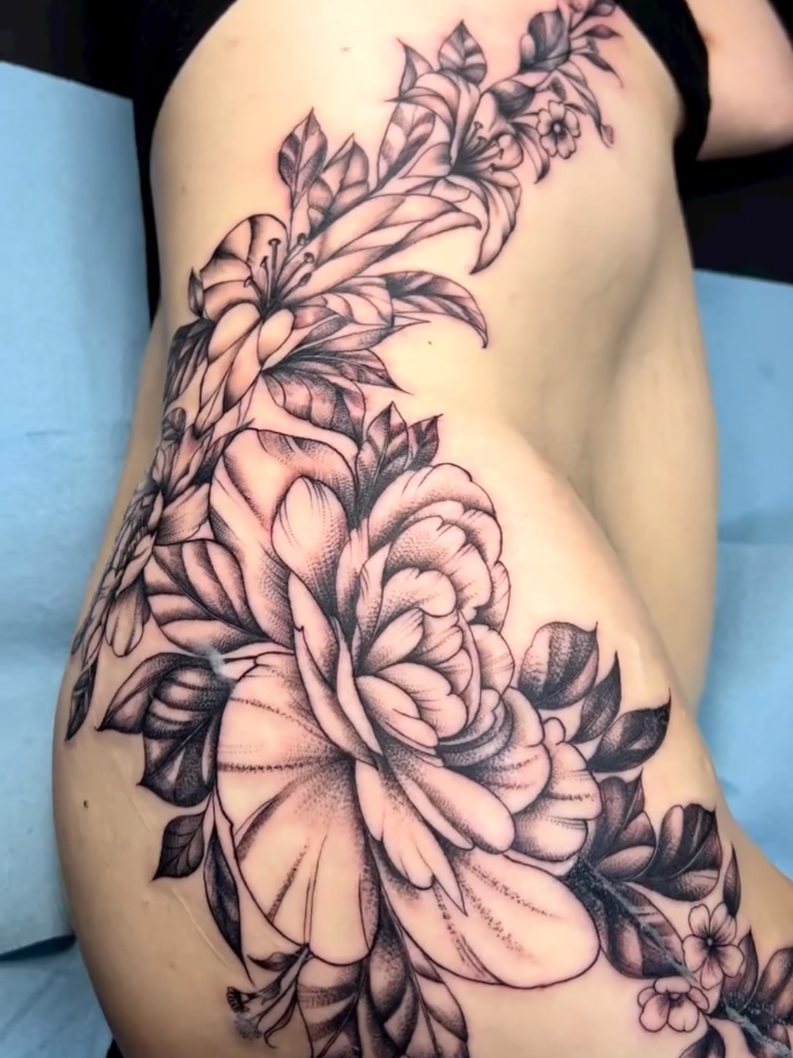 Floral bouquet dotwork tattoo on the shoulder by Tattoomobile