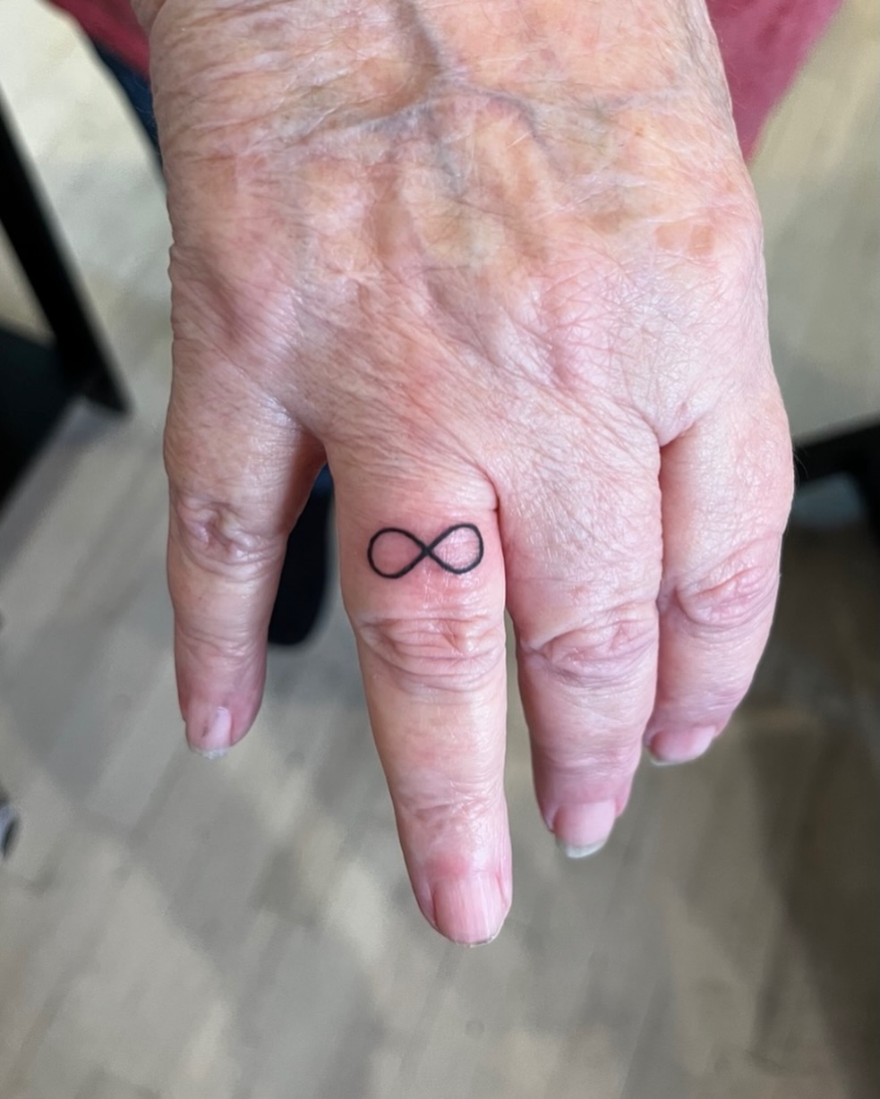 Infinity symbol minimalist tattoo on the hand by DL Tats, Cape Girardeau, Missouri