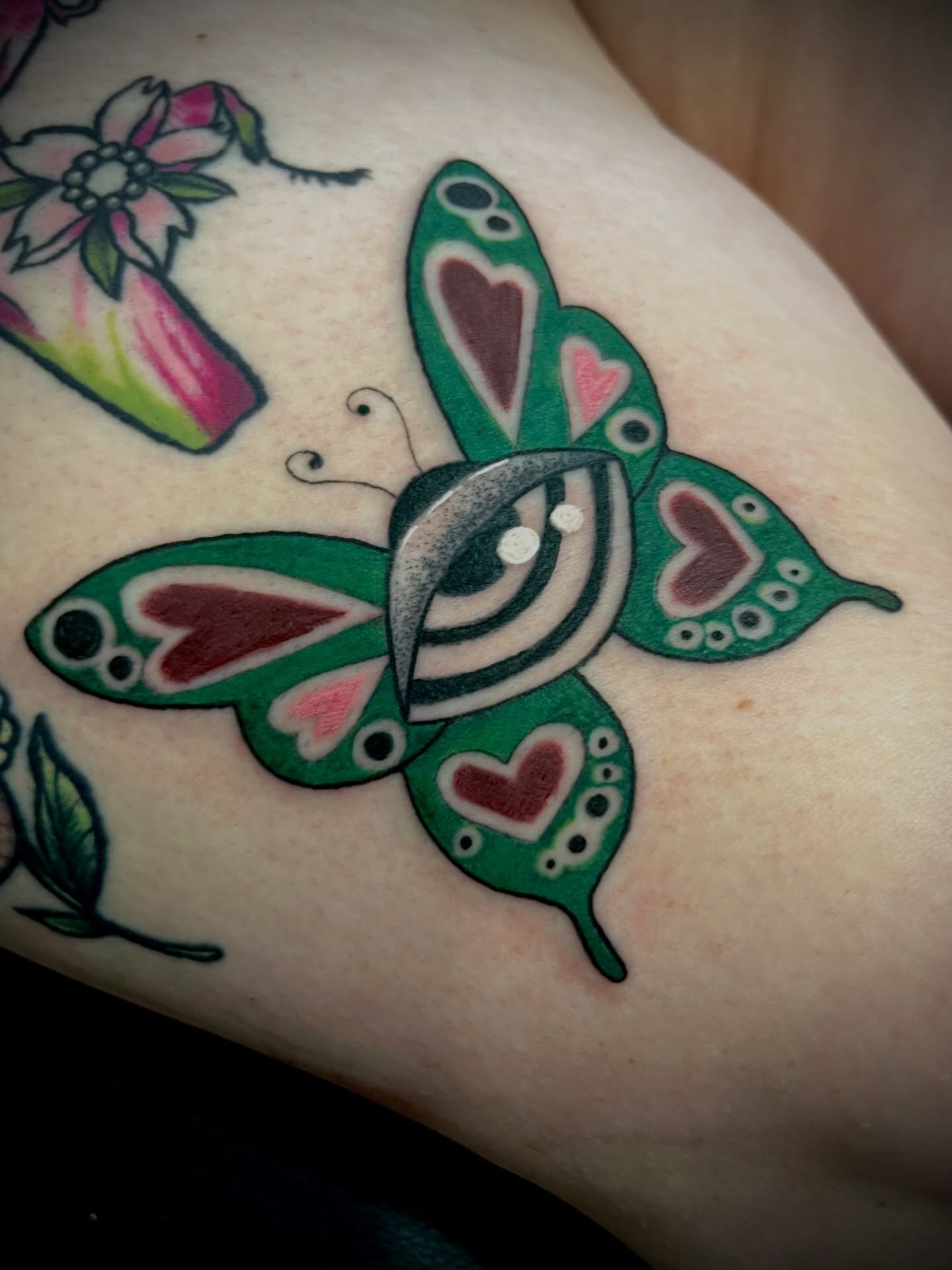 Butterfly American traditional tattoo on the forearm by Freya Petersen