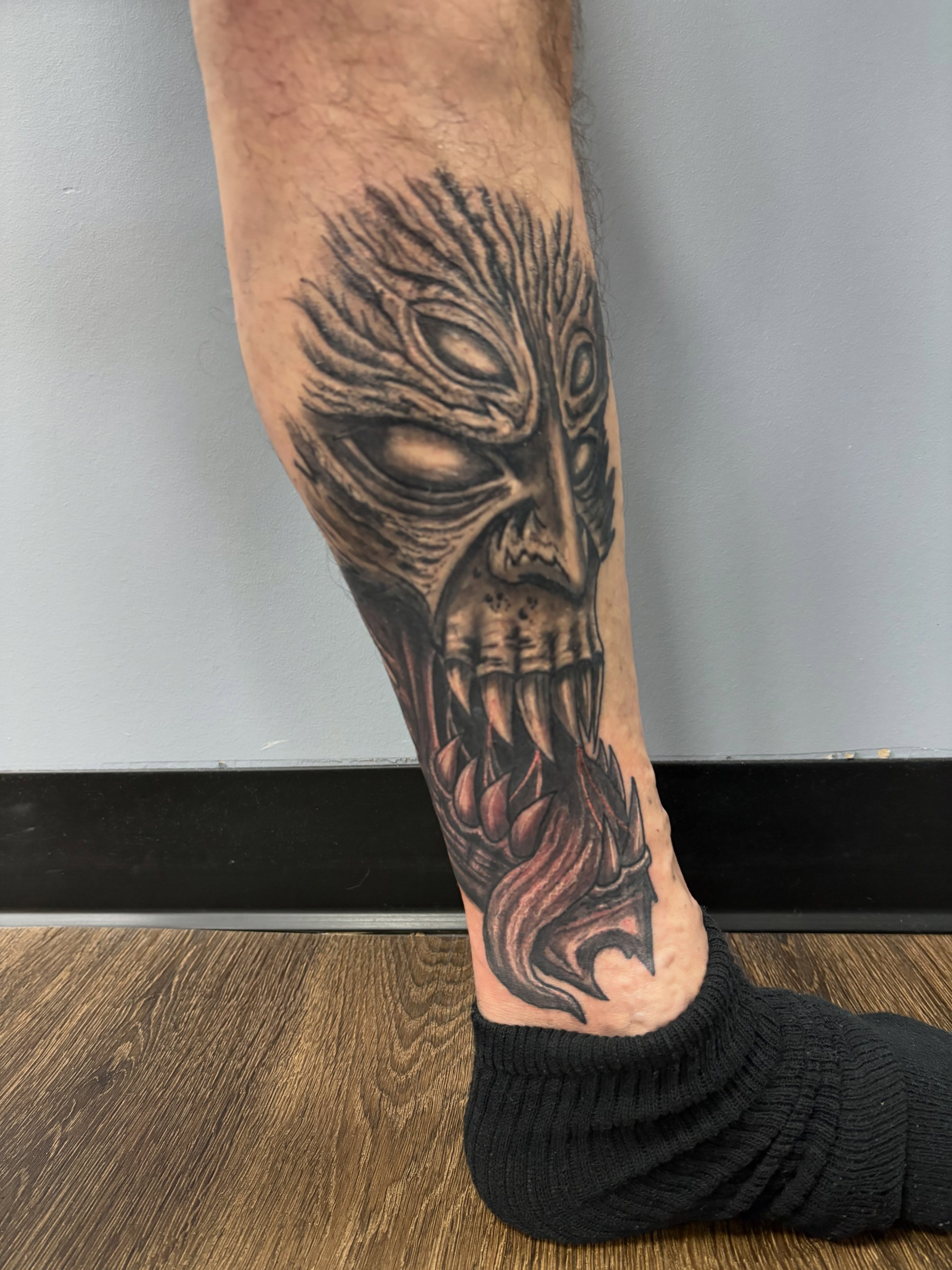 Demon skull dark realism tattoo on the forearm by Jack Ferreri