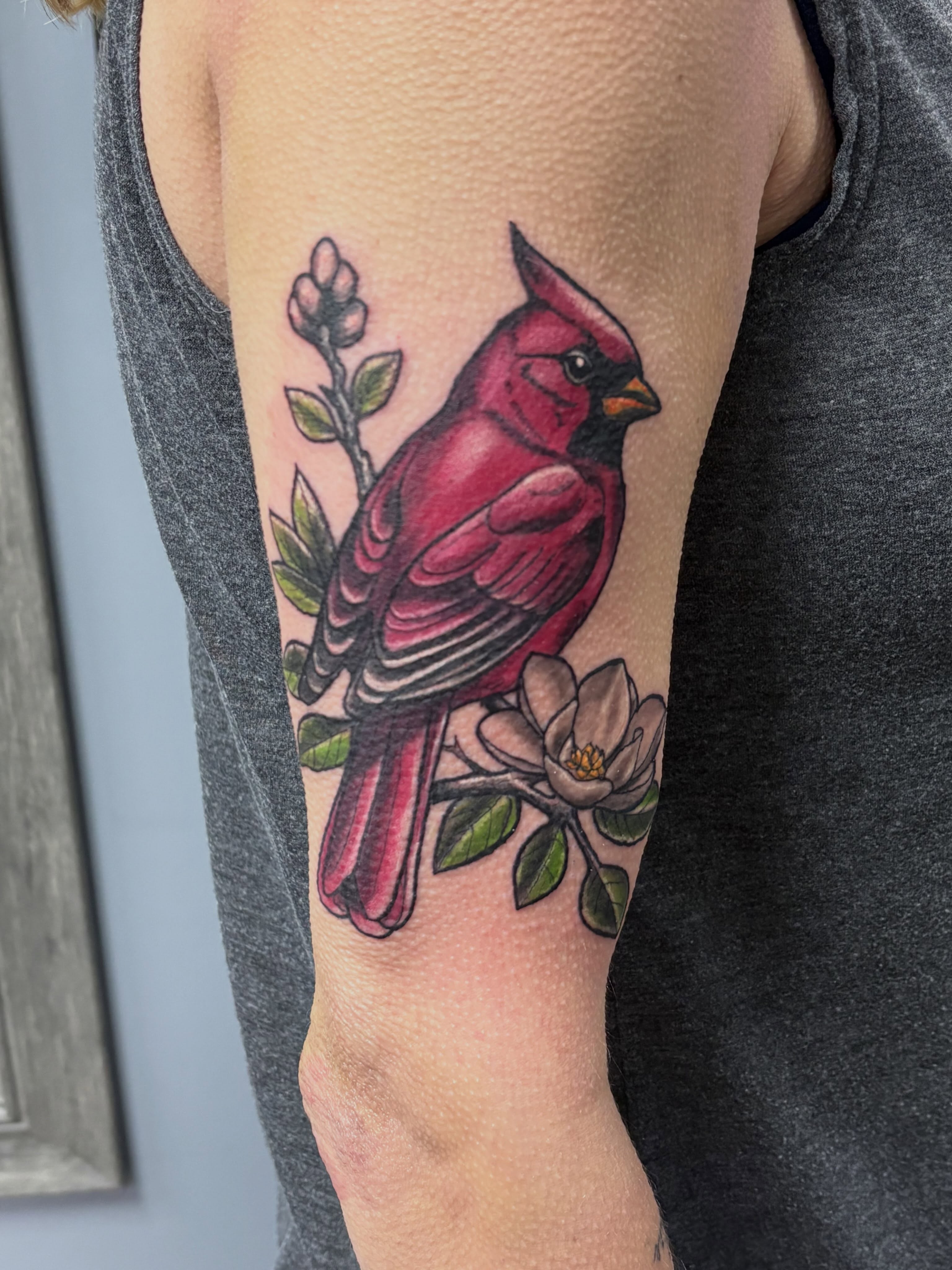 Cardinal bird realism tattoo on the forearm by Jack Ferreri