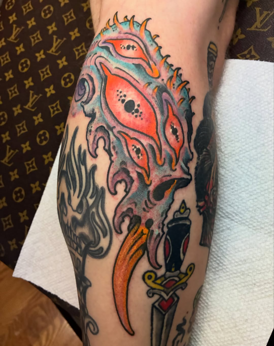Skull with flame American traditional tattoo on the forearm by Joey Knuckles