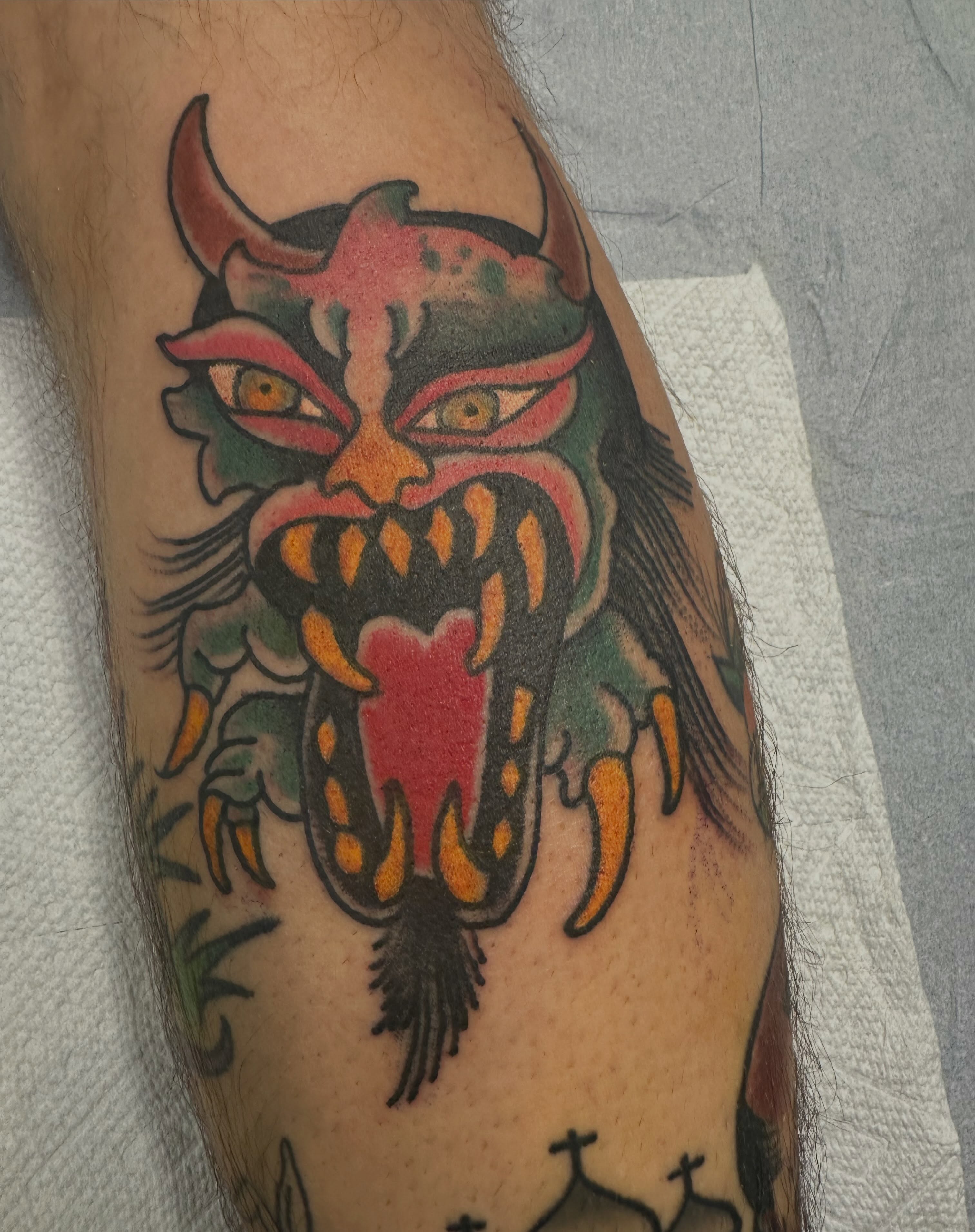 Demon American traditional tattoo on the forearm by Joey Knuckles