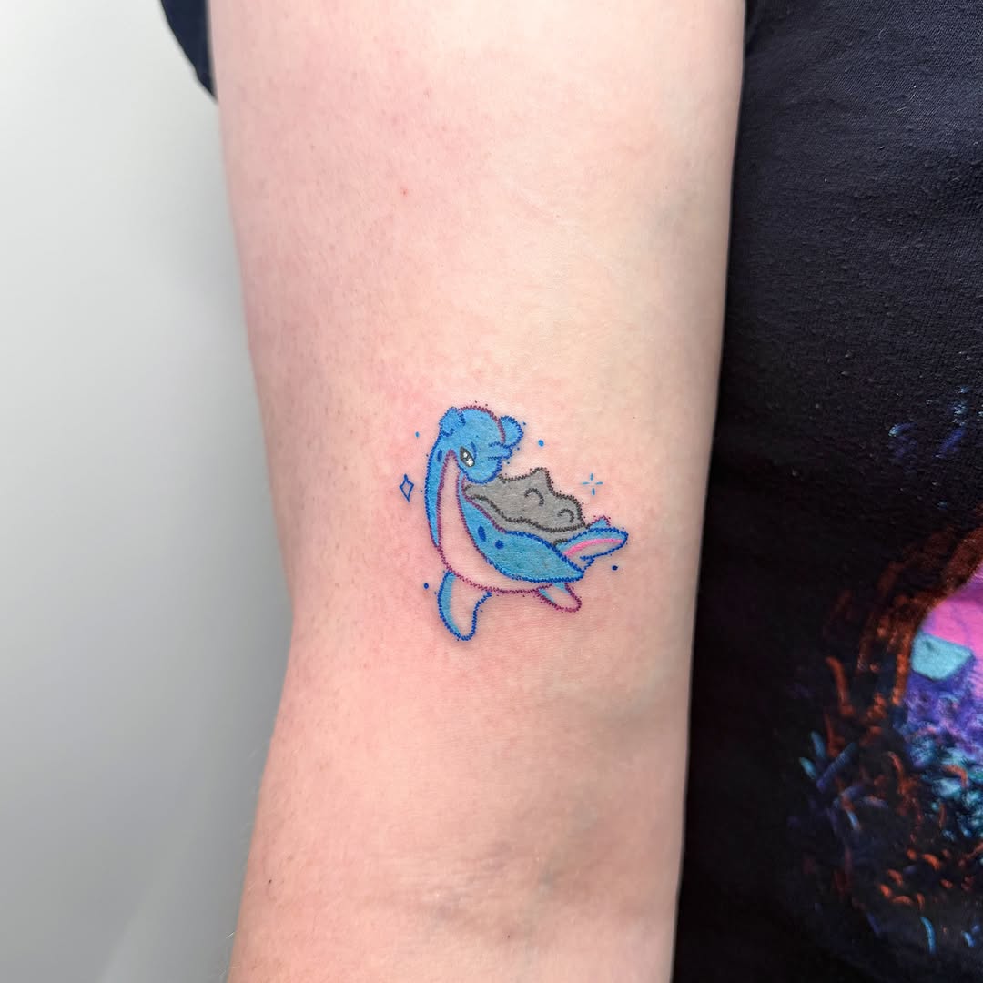 Dolphin holding shell dotwork tattoo on the forearm by Yez tattoo