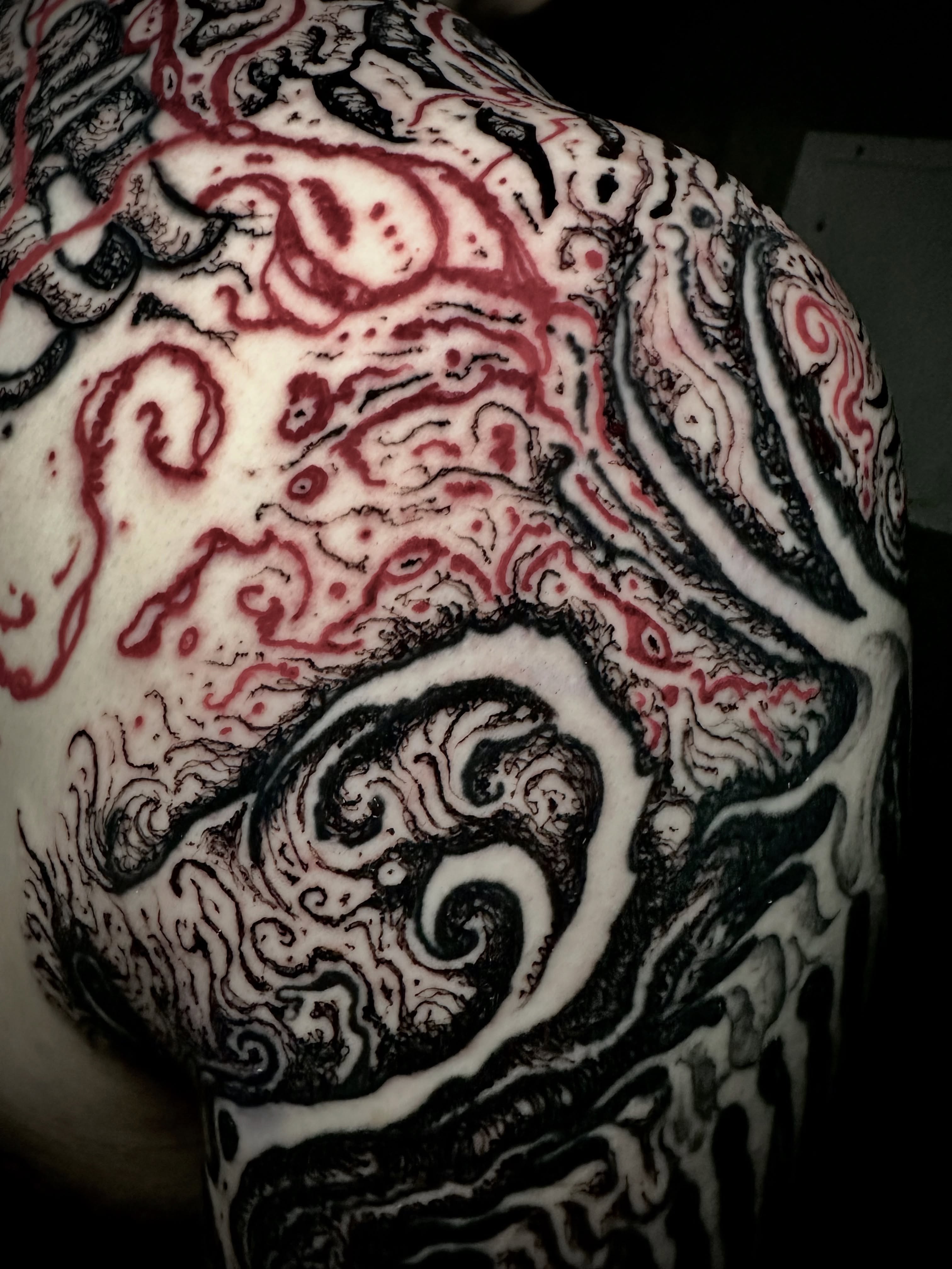 Abstract swirls black and grey tattoo on the shoulder by Noah Durany