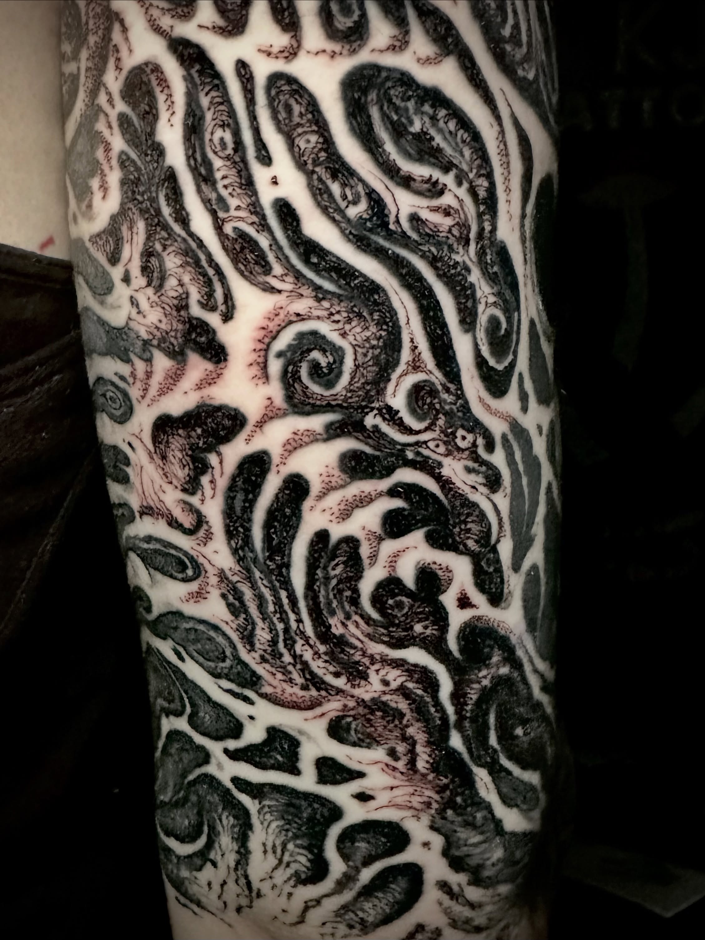 Abstract swirls dotwork tattoo on the forearm by Noah Durany