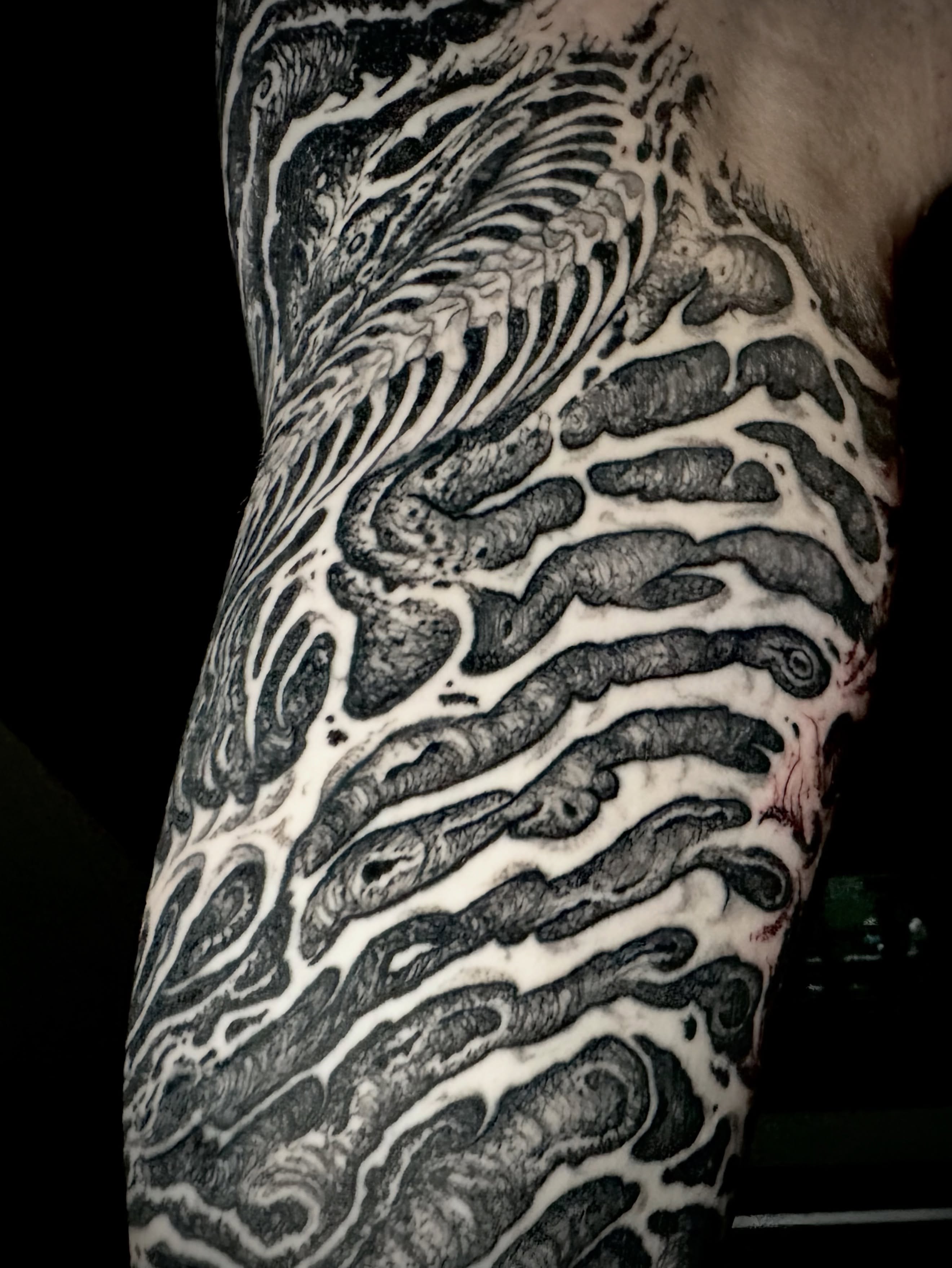 Intestinal worms realism tattoo on the forearm by Noah Durany