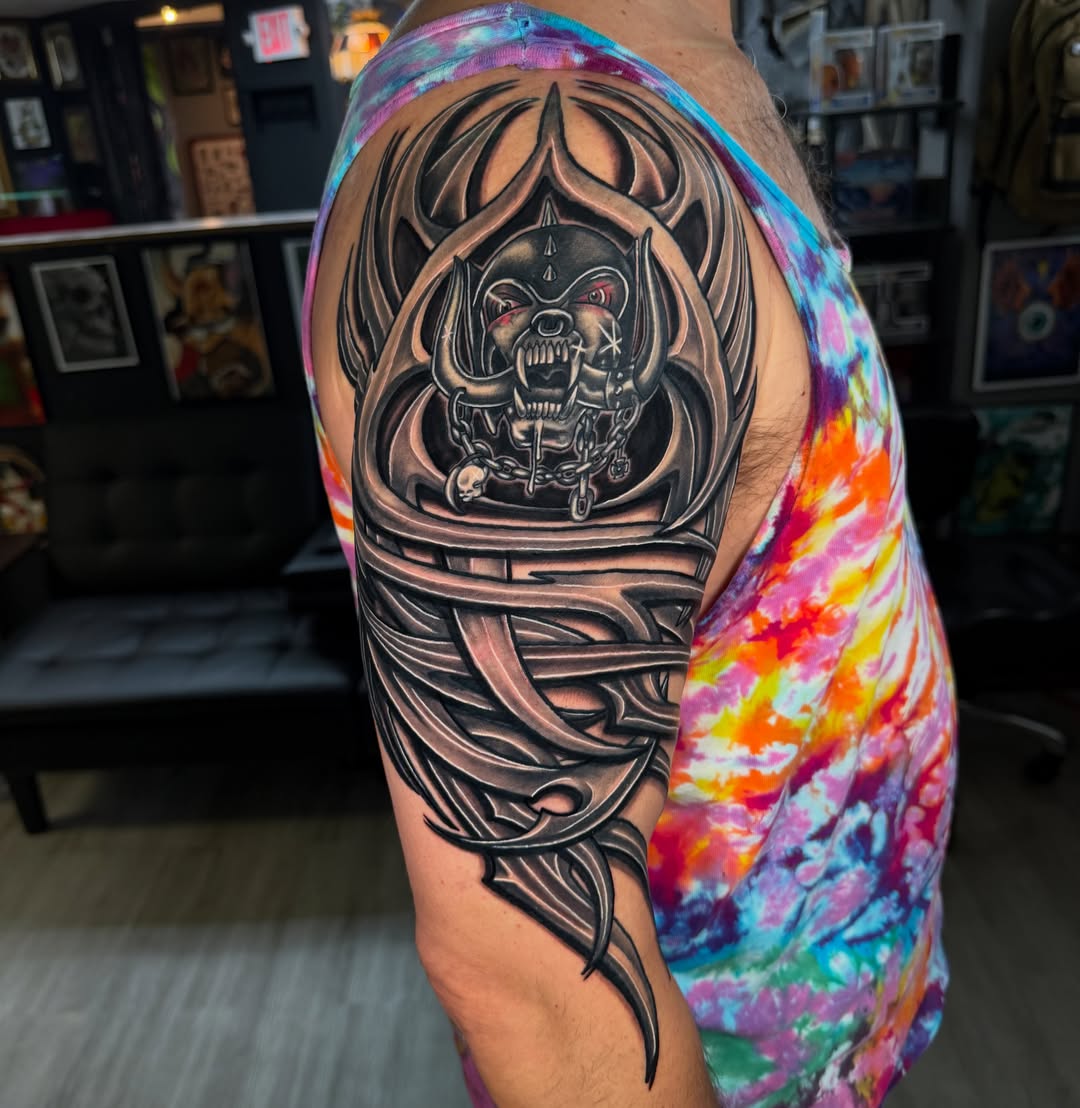 Skull with chains dark realism tattoo on the shoulder by Beau Zeis
