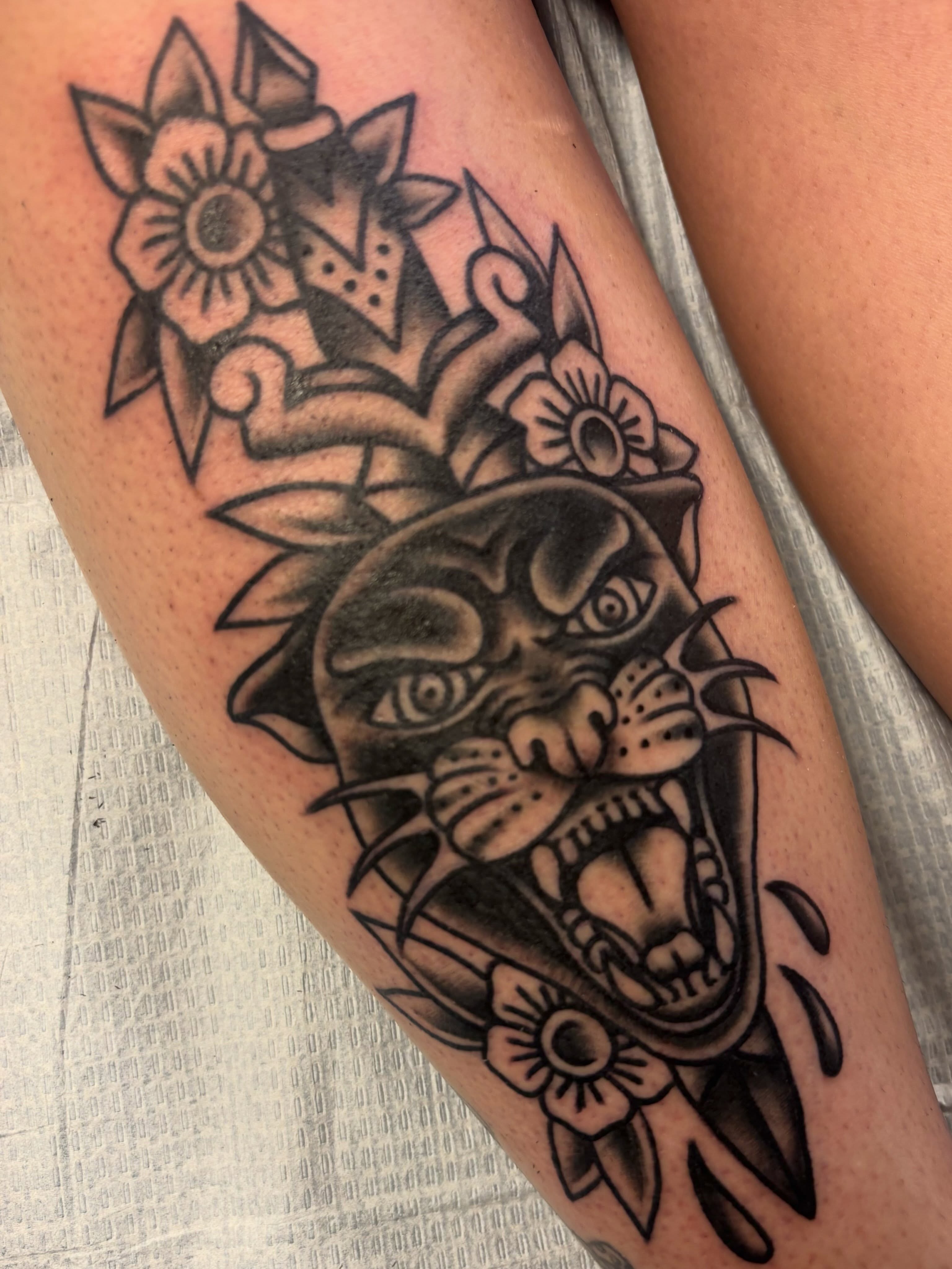 Panther head American traditional tattoo on the forearm by Alex Green, Nashville, Tennessee