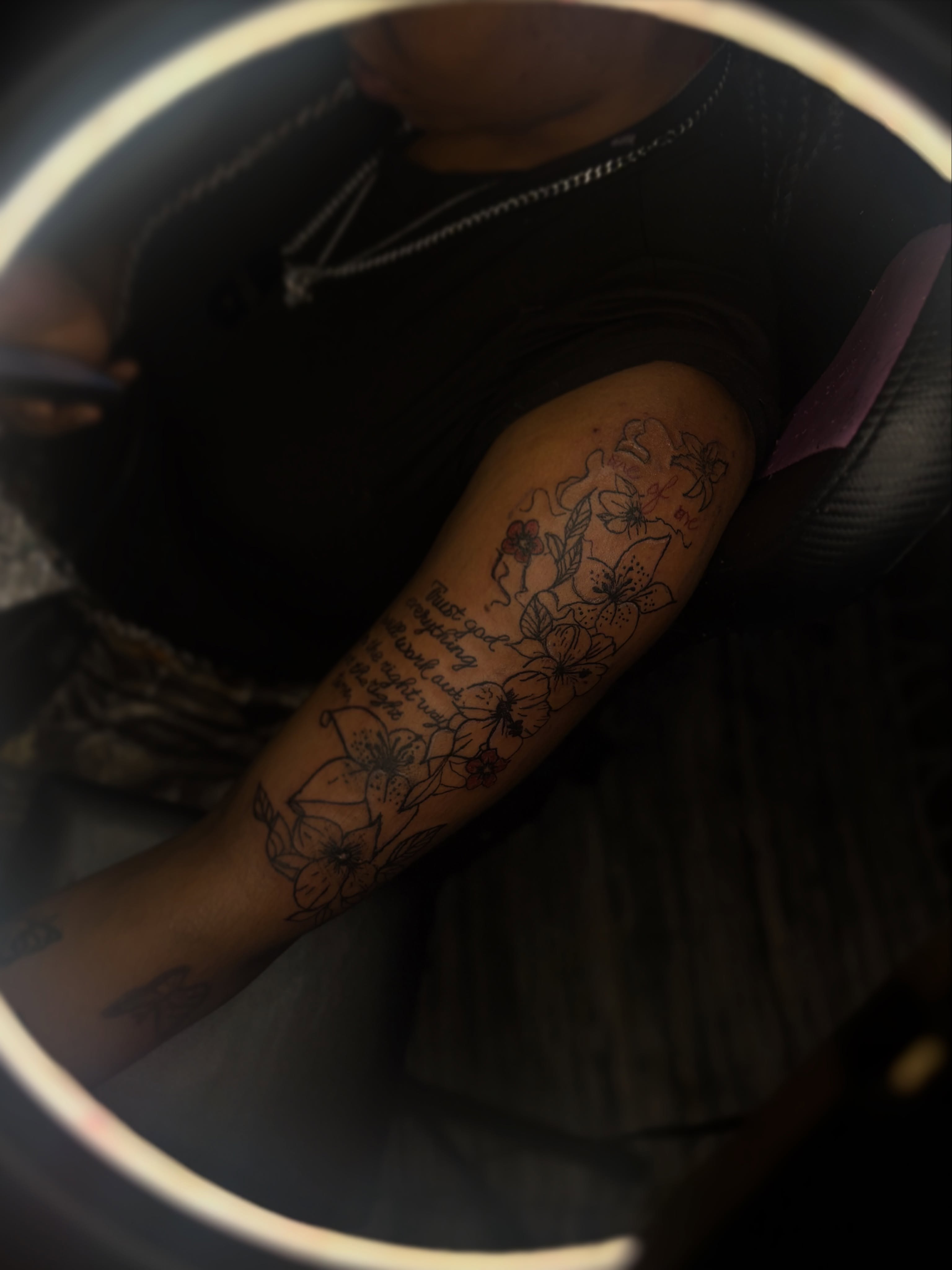 Floral arrangement black and grey tattoo on the forearm by Winter j