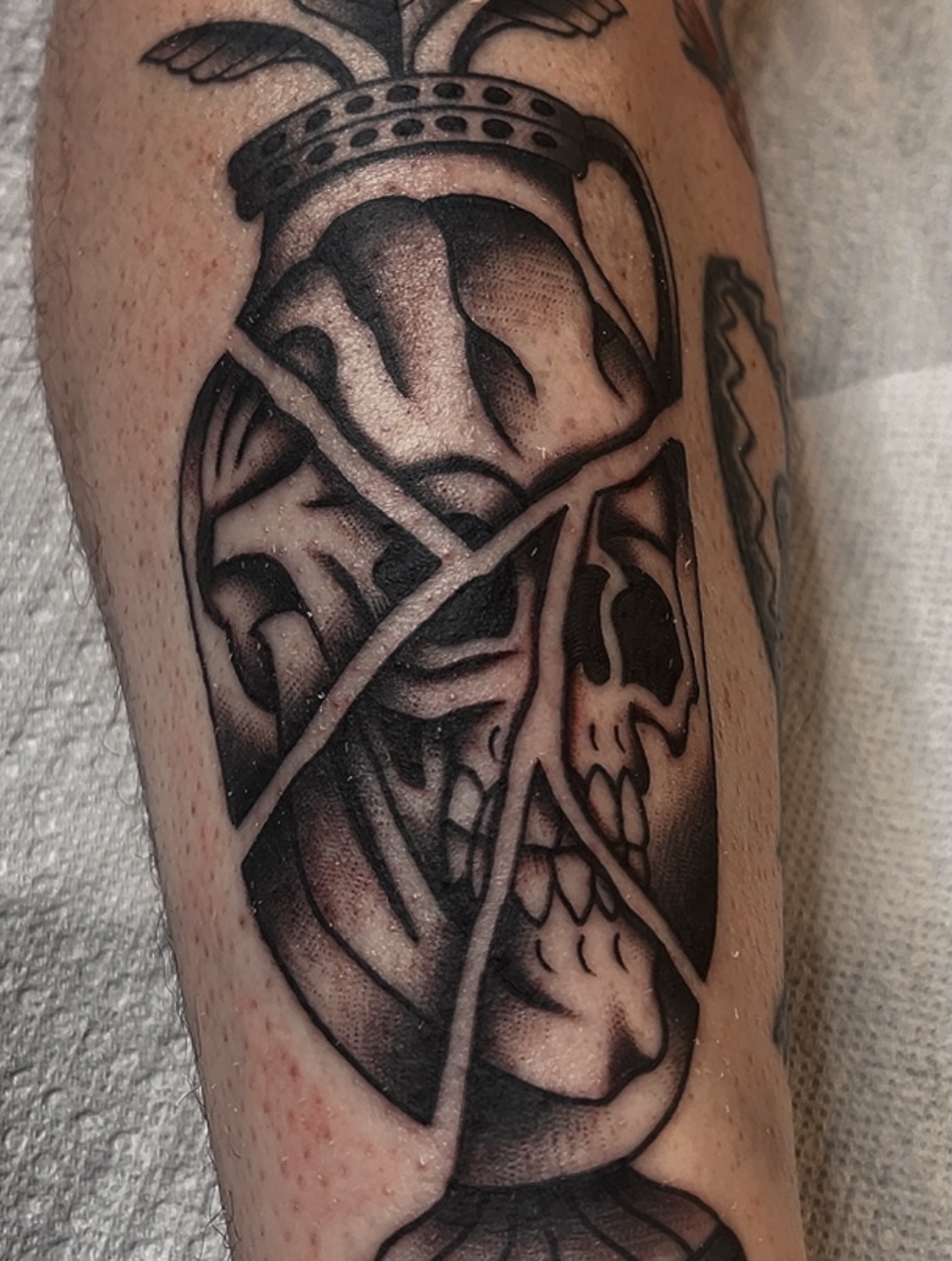 Skull with crown realism tattoo on the forearm by Las Vegas Tattoo Artist