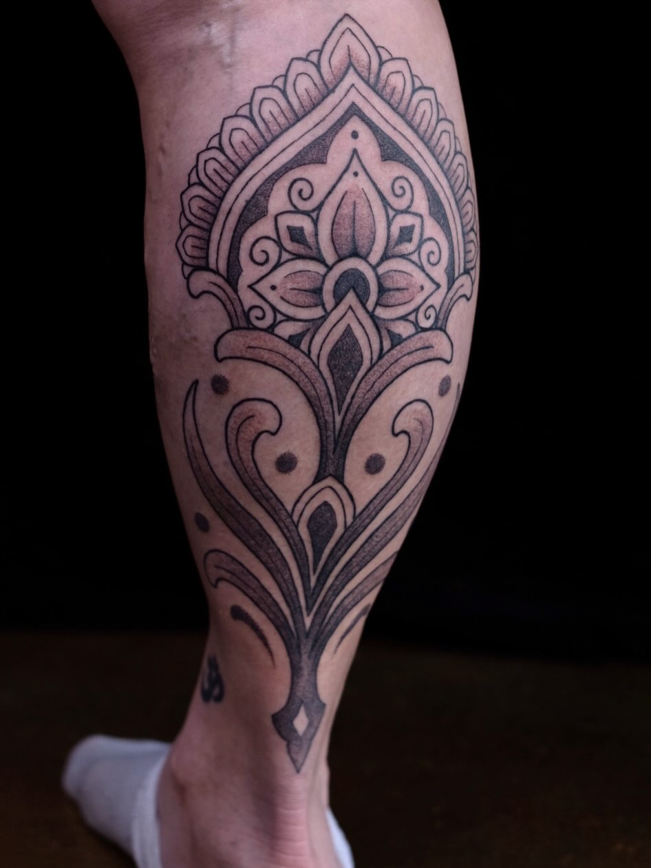 Mandala ornamental tattoo on the calf by Owlyn Madrone