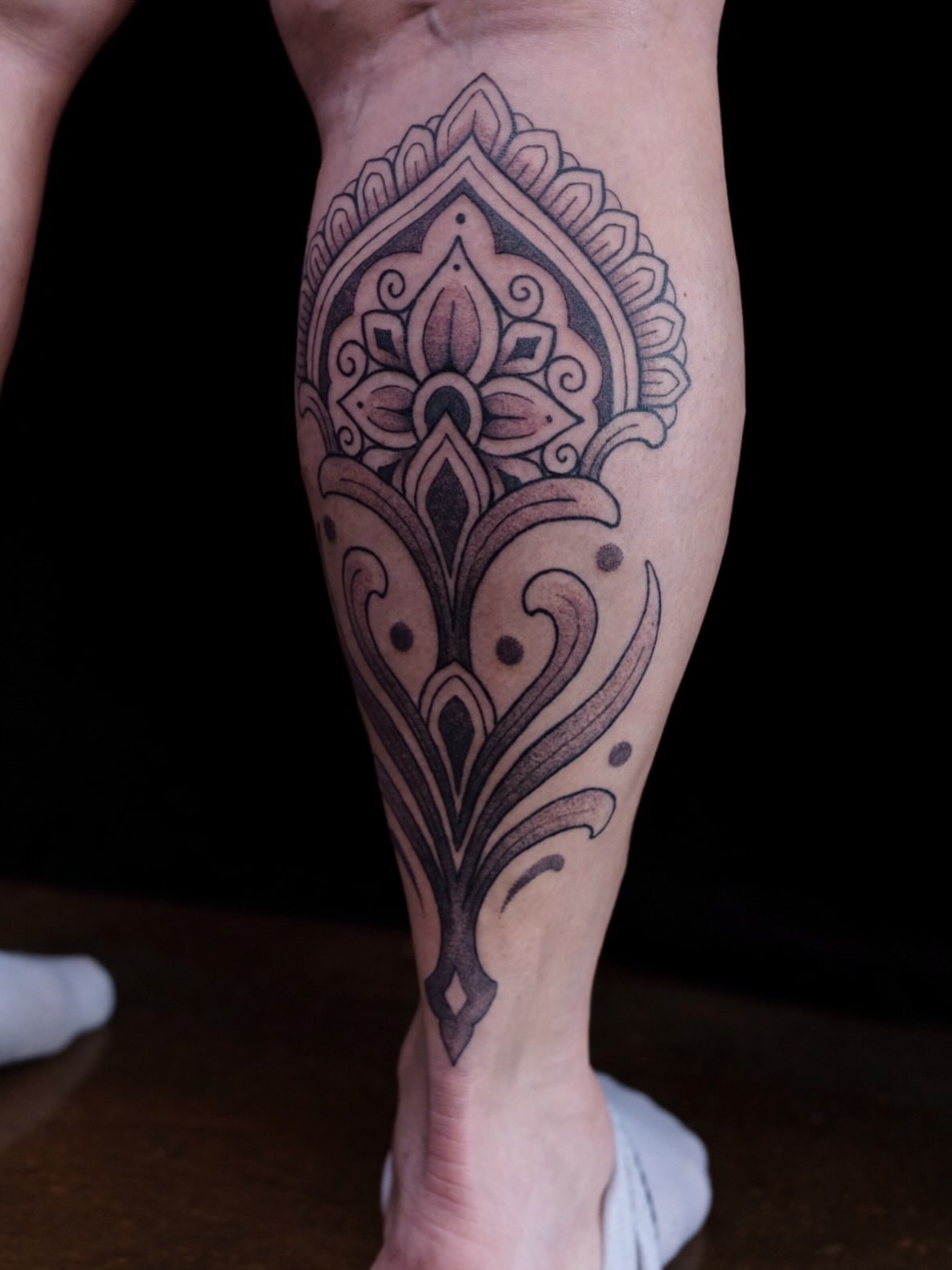 Mandala ornamental tattoo on the calf by Owlyn Madrone
