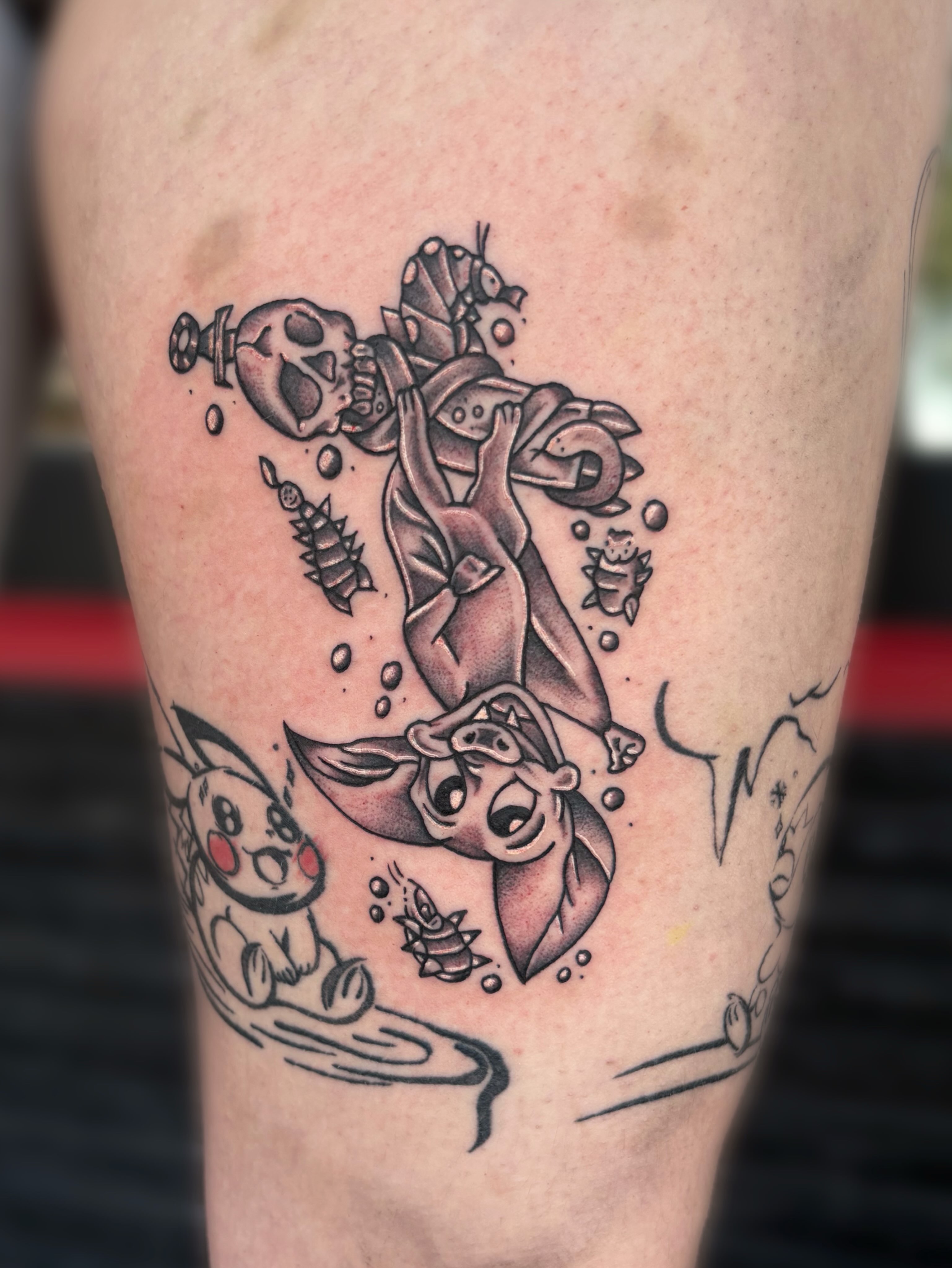 Mermaid and skull realism tattoo on the thigh by Ava Brady Tattoos