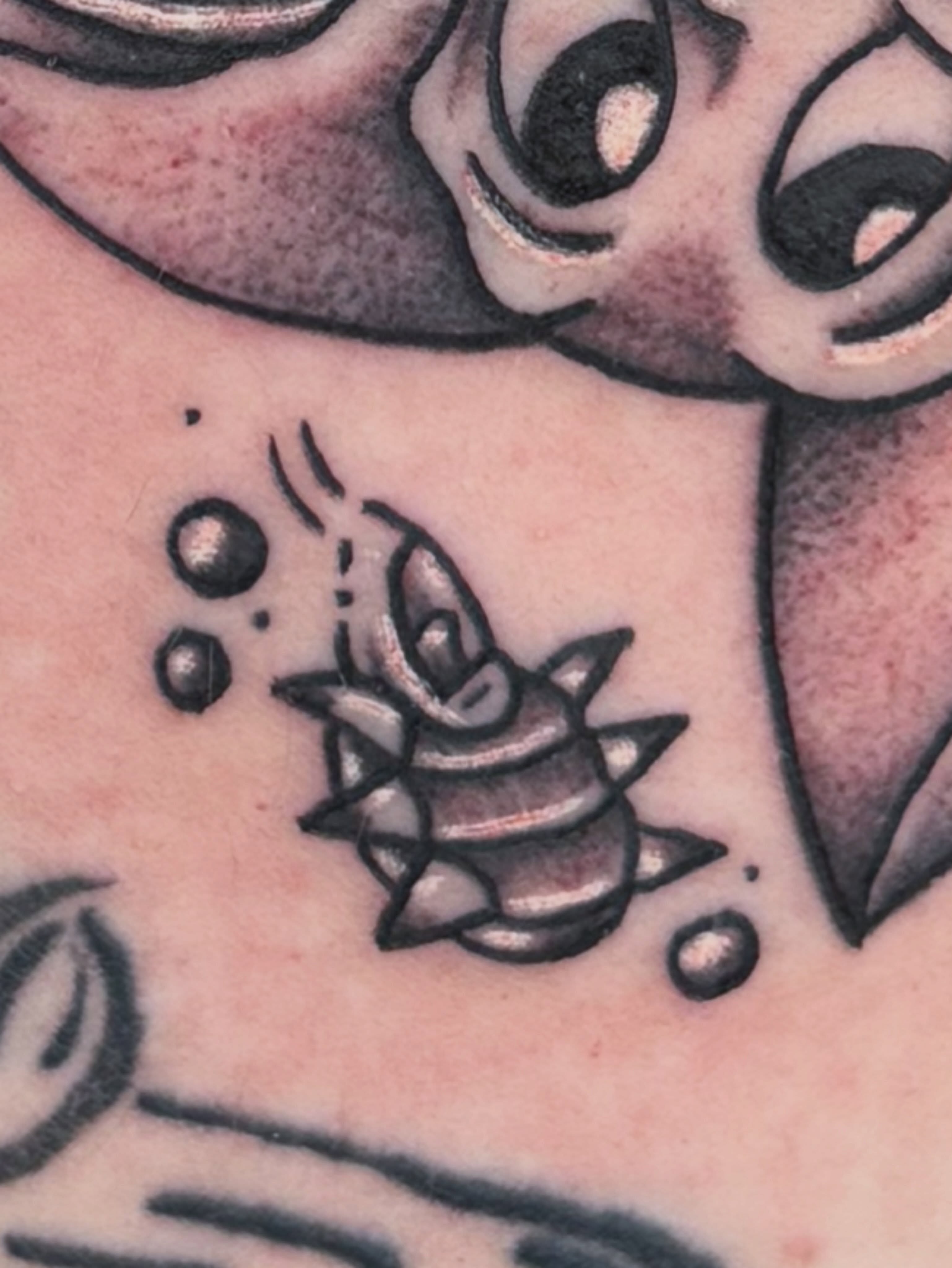 Bee black and grey tattoo on the chest by Ava Brady Tattoos