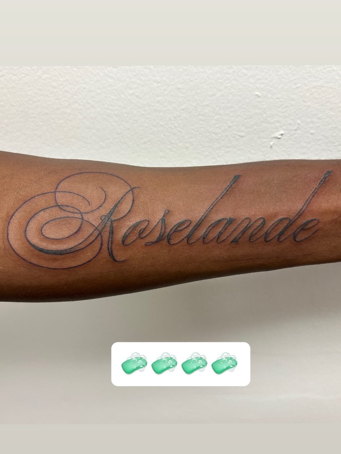 Roselande lettering script tattoo on the forearm by Chris