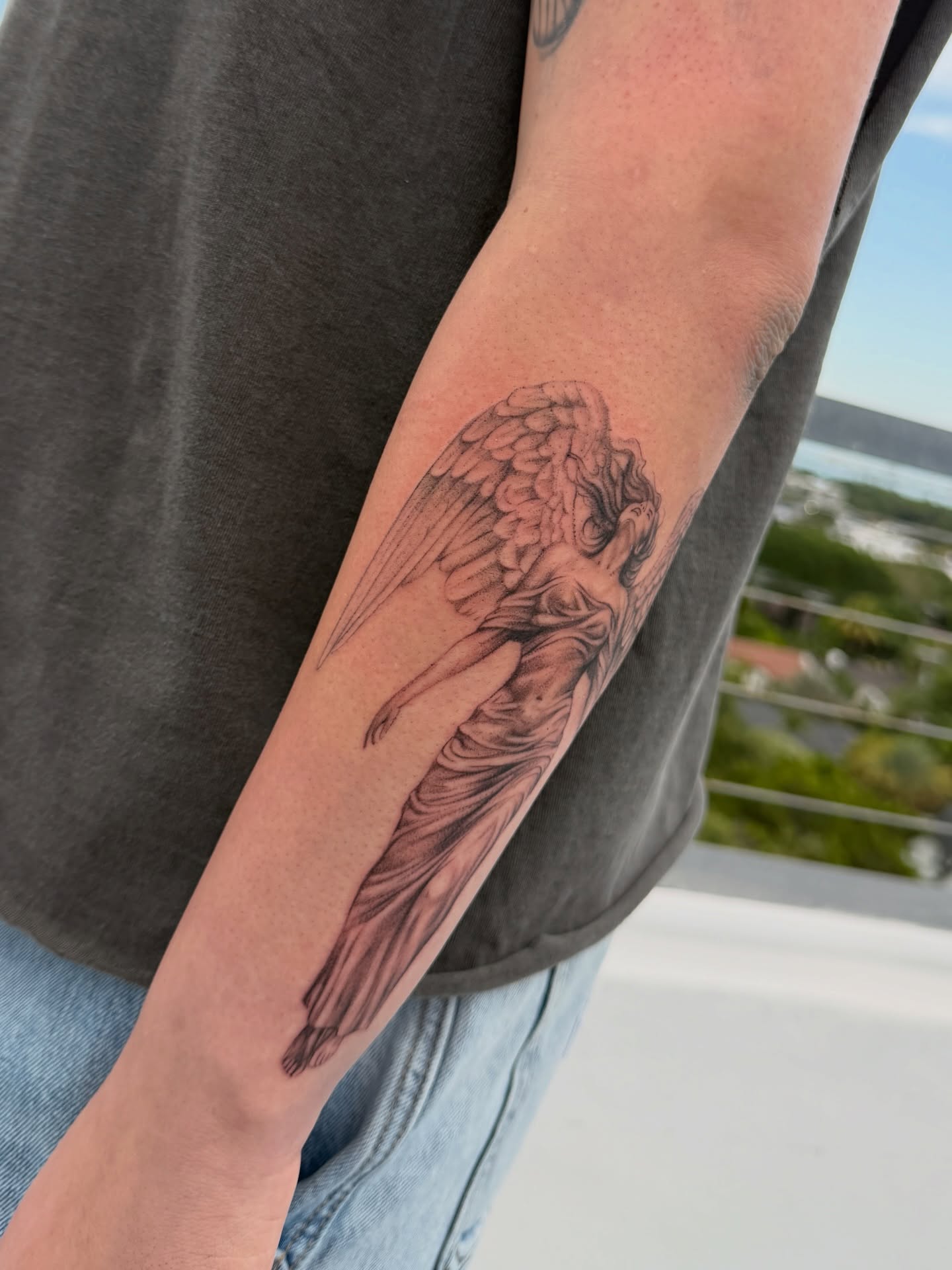 Angel realism tattoo on the forearm by Valery Cardona