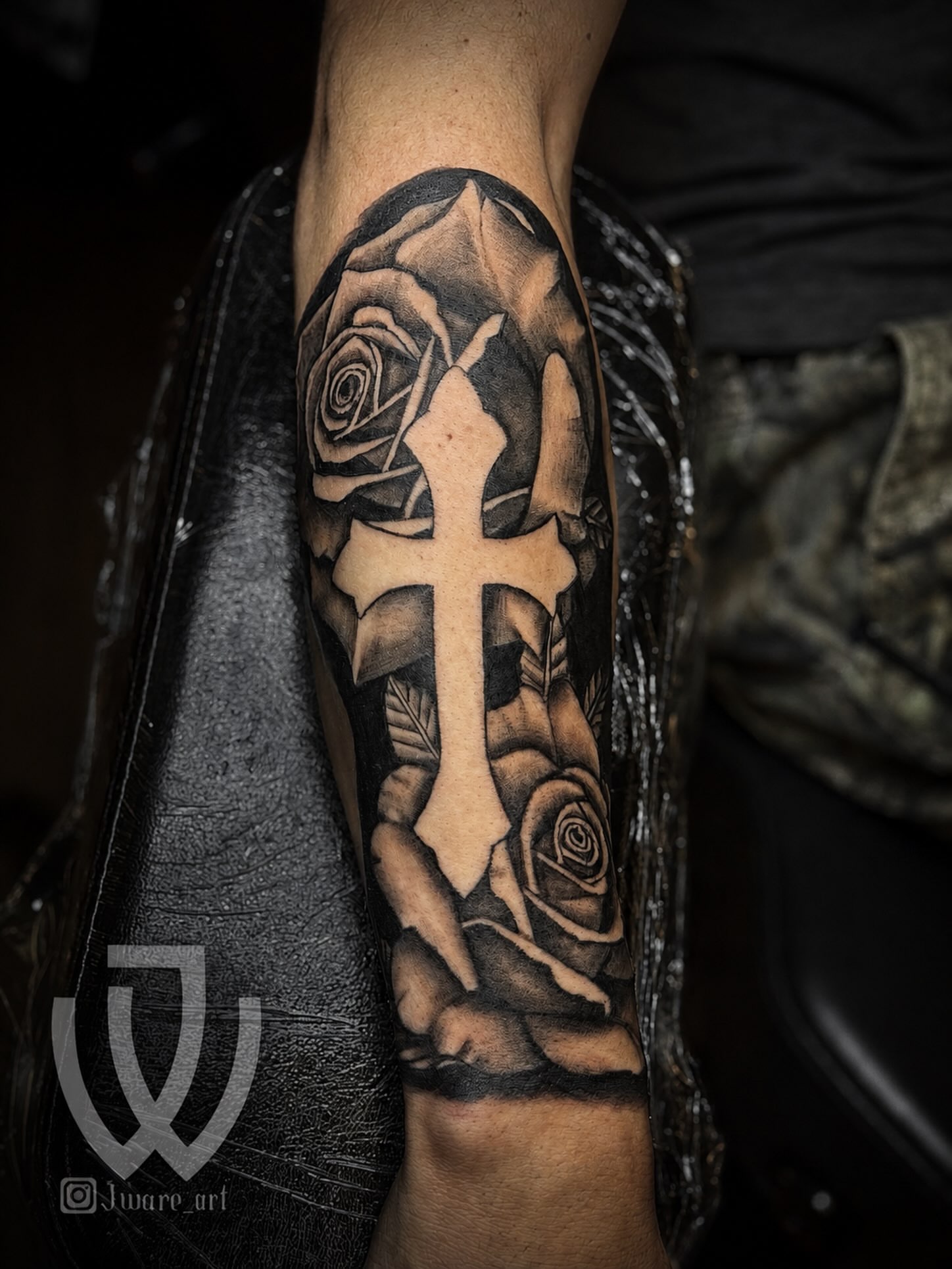 Cross and roses realism tattoo on the forearm by Joshua Ware, Alvarado, Texas