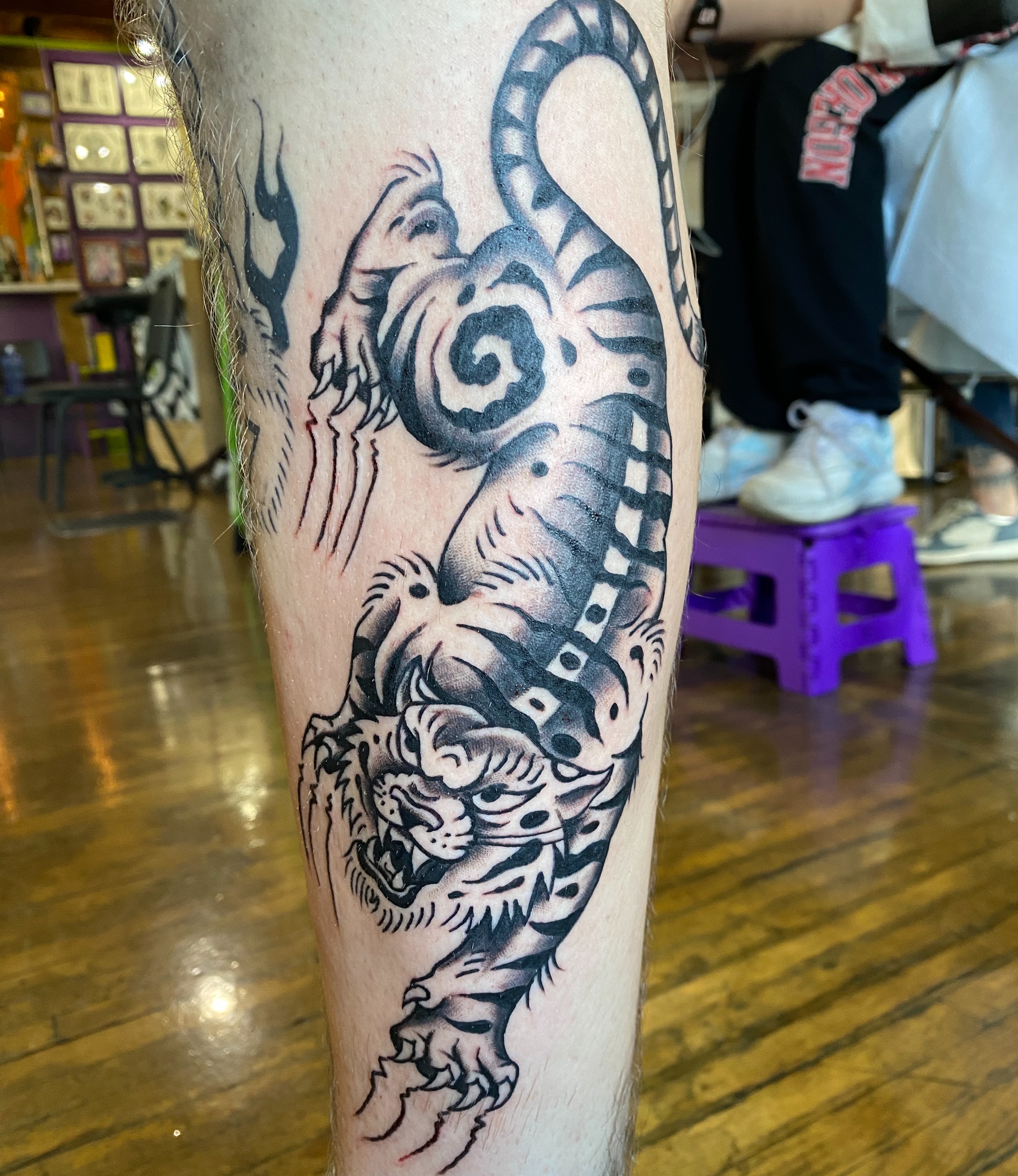 Tiger black and grey tattoo on the leg by Karl Hegwein, Portland, Oregon