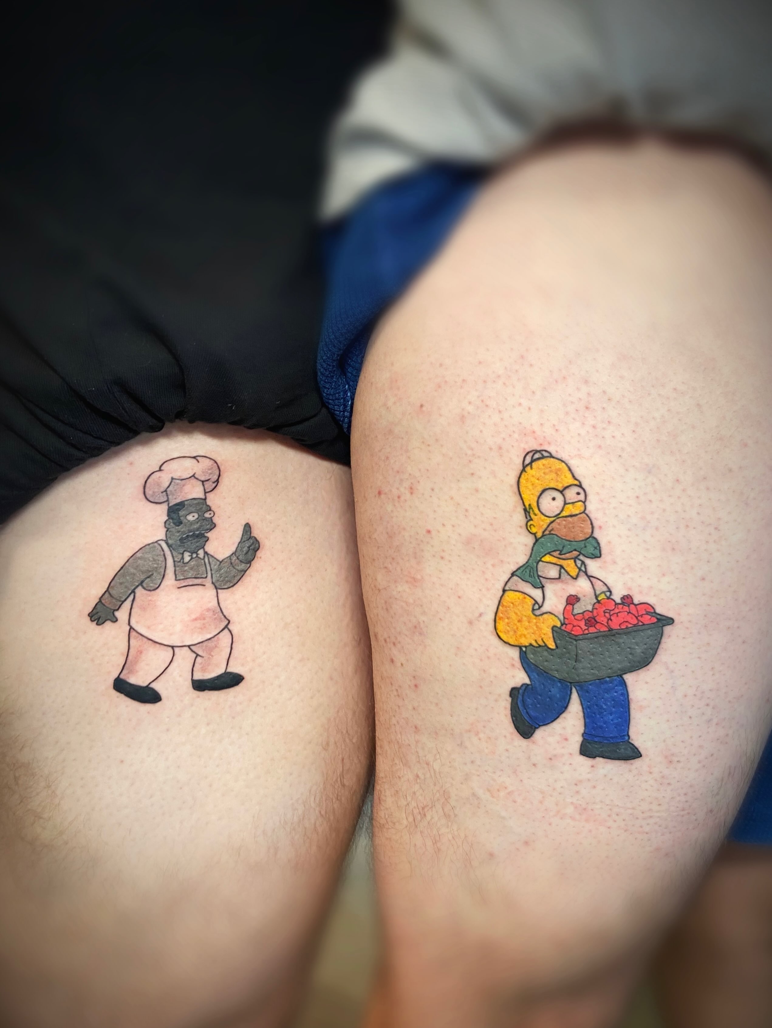 Homer simpson and chef dotwork tattoo on the thigh by San Diego Tattoo Artist