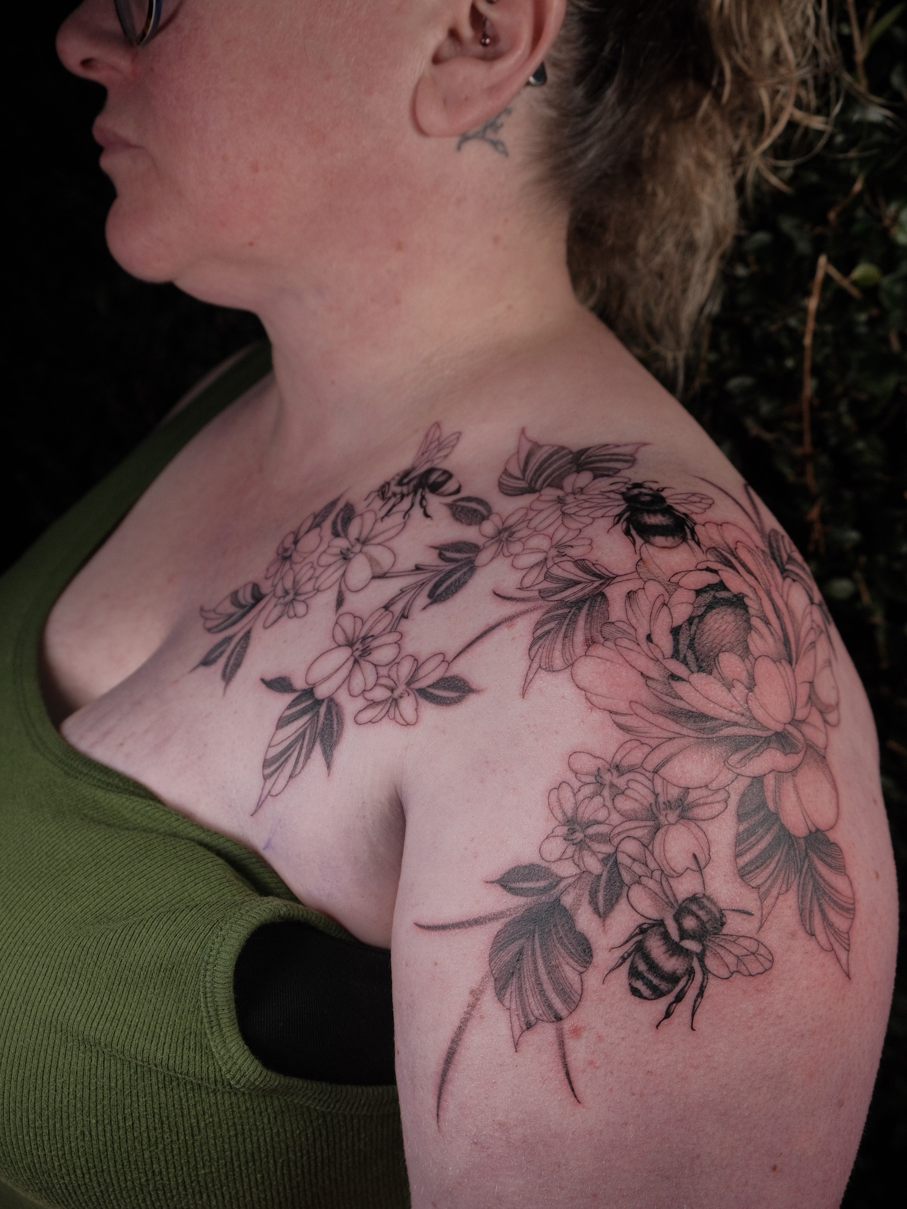 Bees and flowers realism tattoo on the shoulder by JoeyJazz