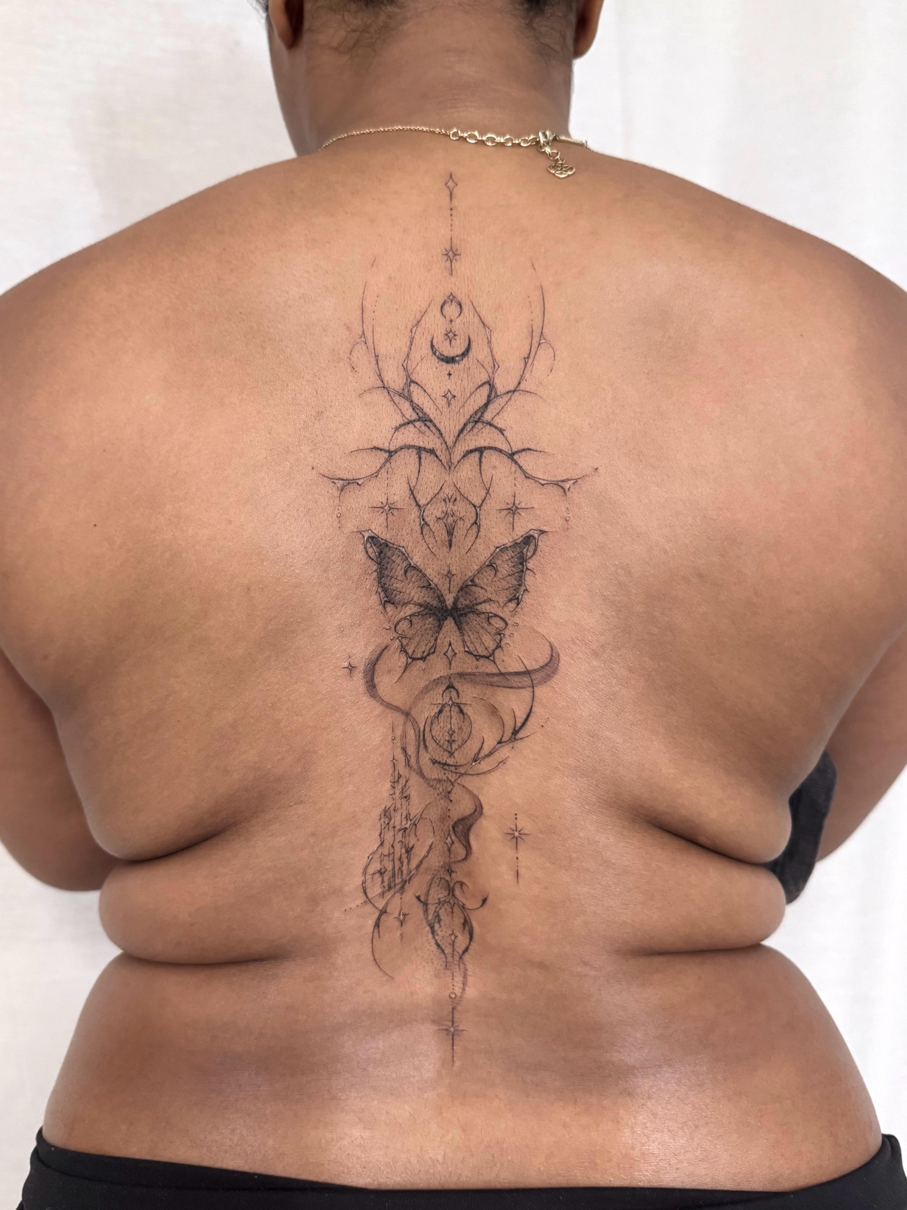 Butterfly and floral geometric tattoo on the back by ๐๐๐๐๐๐