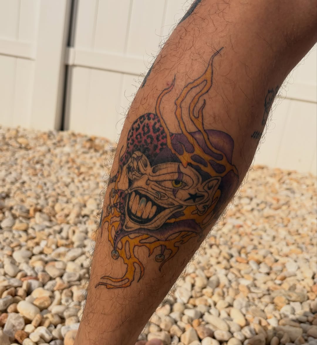 Joker head American traditional tattoo on the forearm by sechi