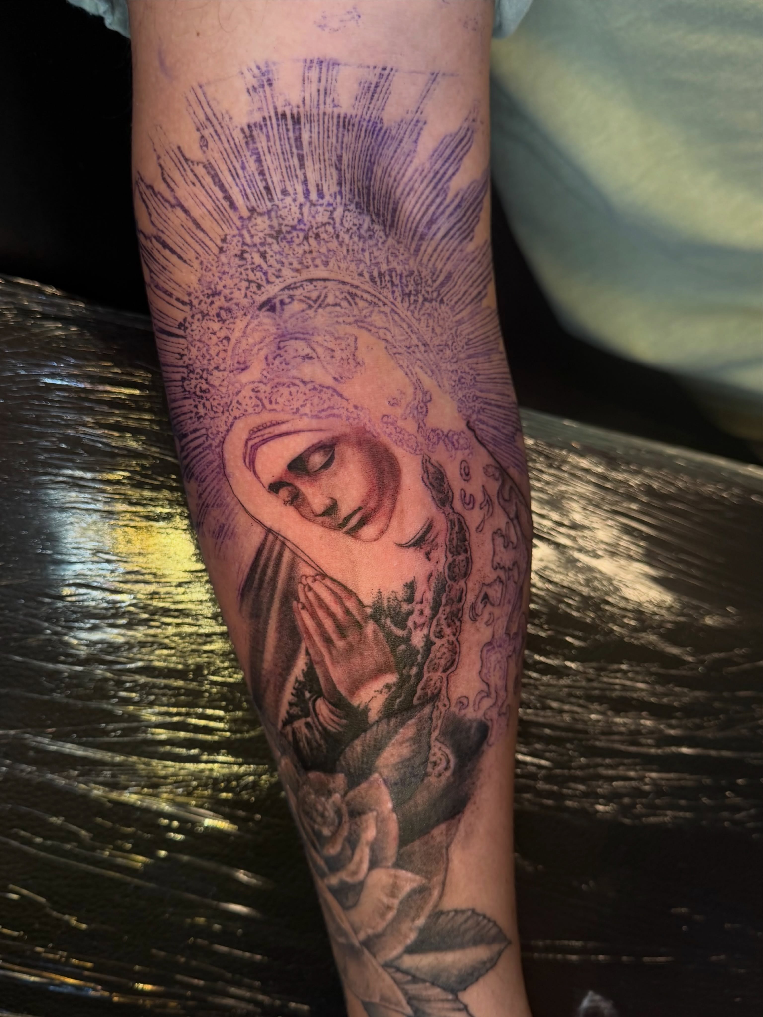 Religious figure praying black and grey tattoo on the forearm by Eugene Oregon tattoo artist