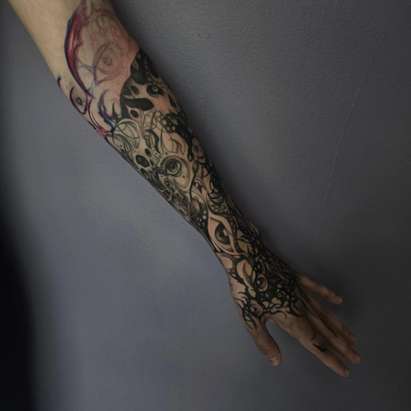 Abstract pattern black and grey tattoo on the forearm by Ema Fish