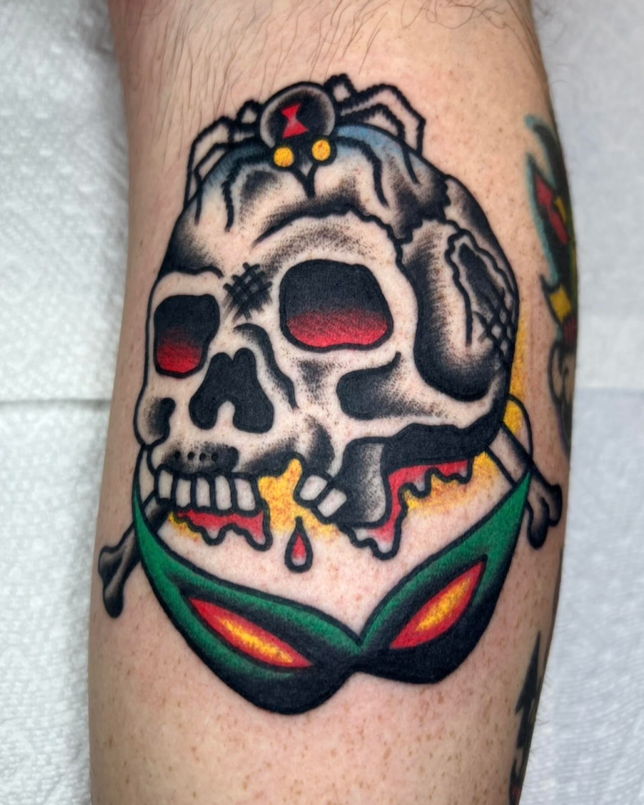 Skull American traditional tattoo on the forearm by Tattoo