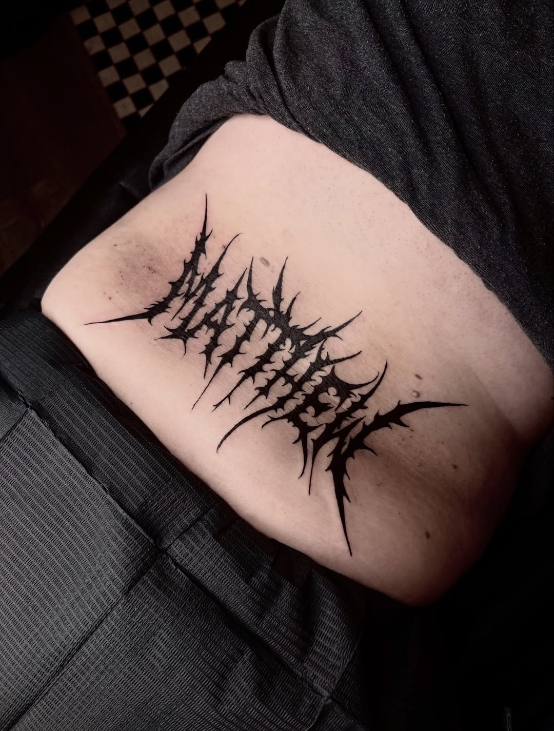 Tattoo by @justjellytattoos — blackwork, lettering_script
