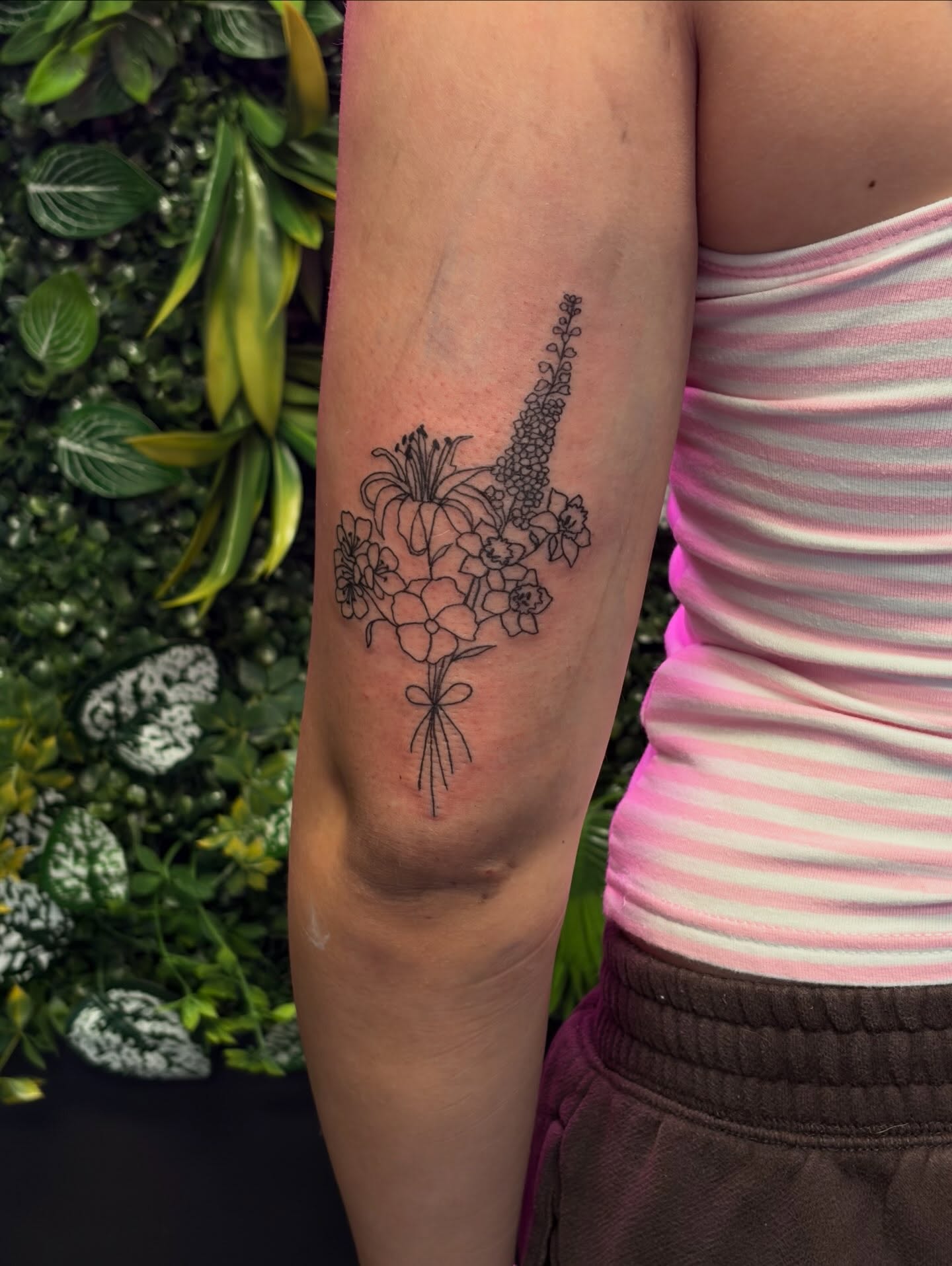 Flower bouquet black and grey tattoo on the forearm by Melissa