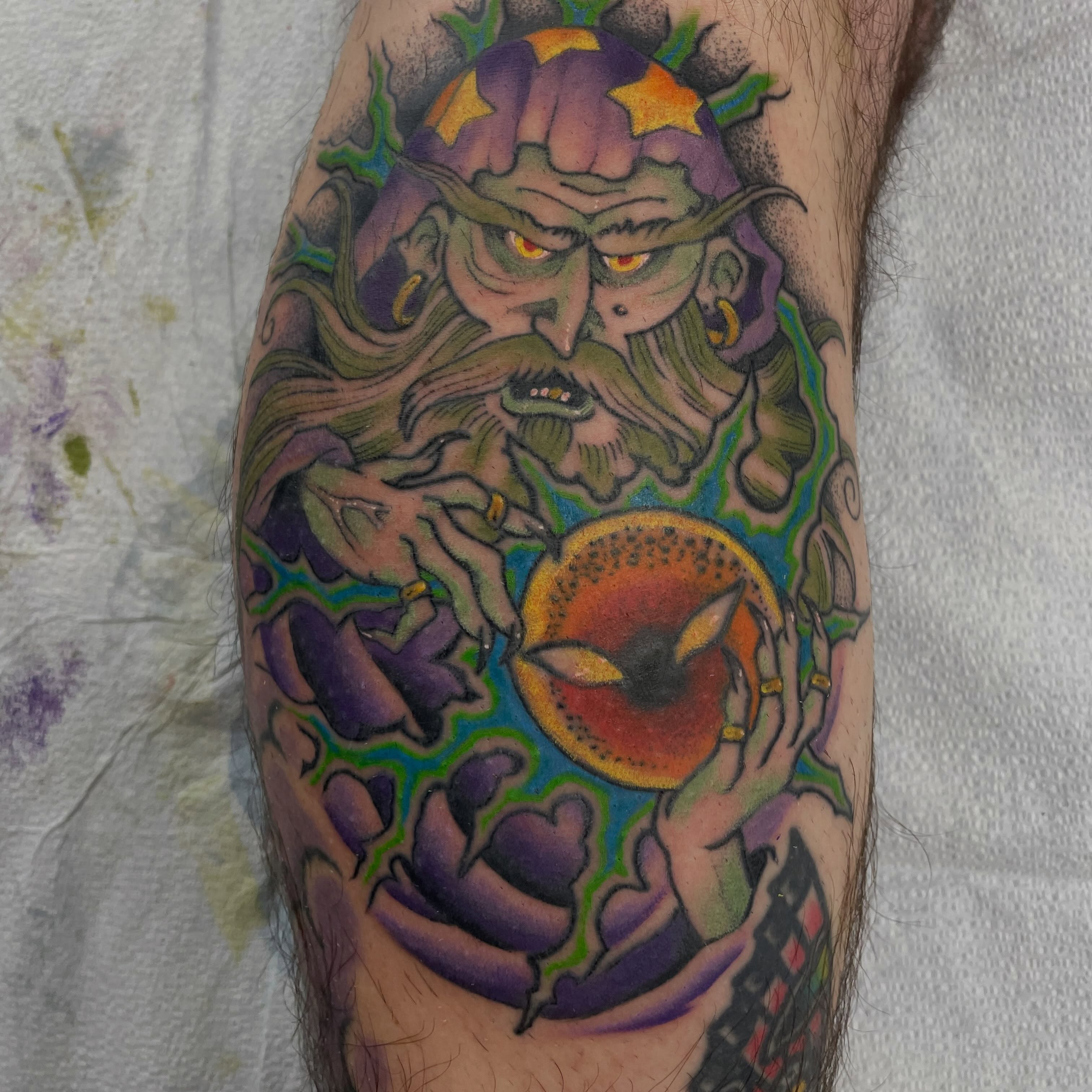 Demon with apple dotwork tattoo on the forearm by Fionna Fanning