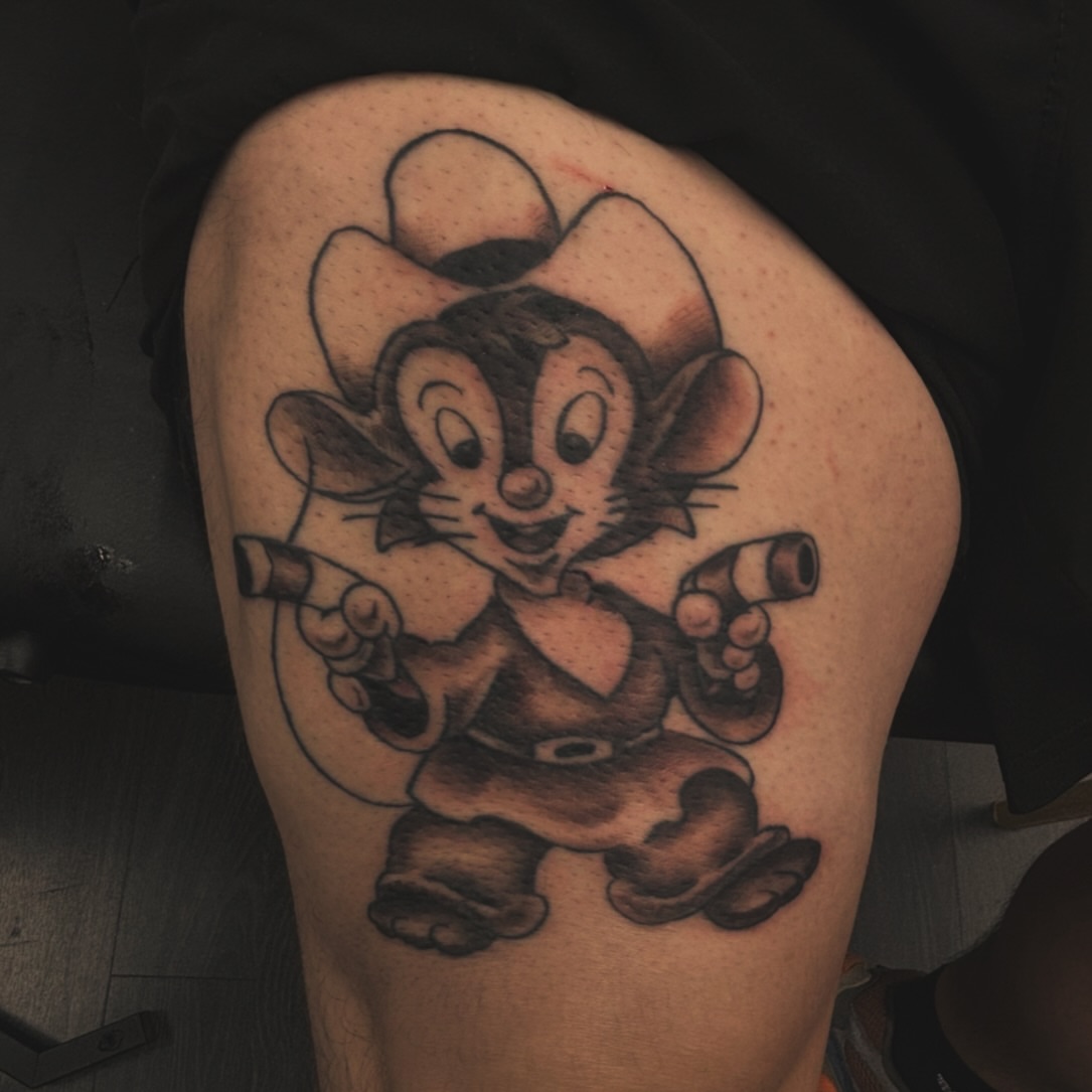 Chipmunk character black and grey tattoo on the thigh by Gabe Rosen