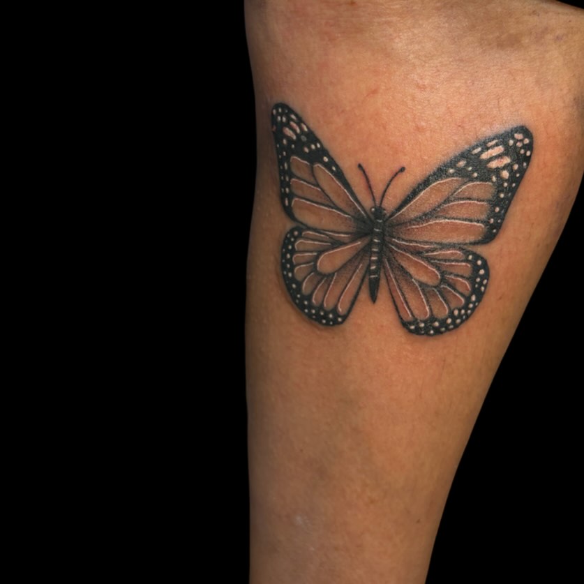 Monarch butterfly dotwork tattoo on the forearm by Tattoomobile