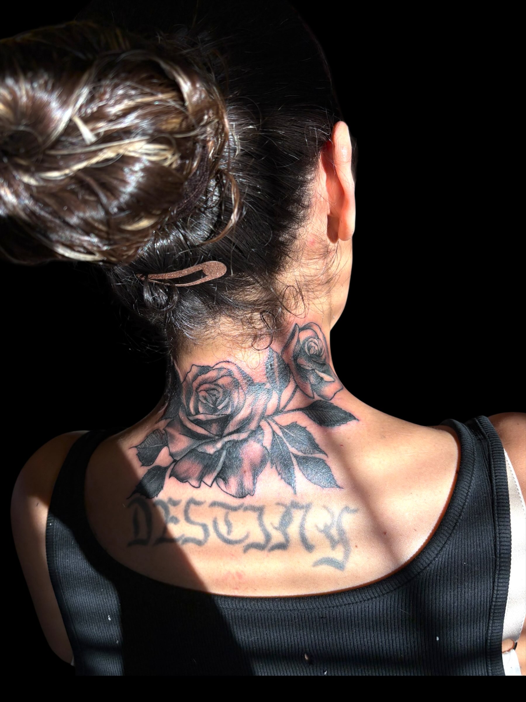 Roses and script black and grey tattoo on the neck by Tattoomobile