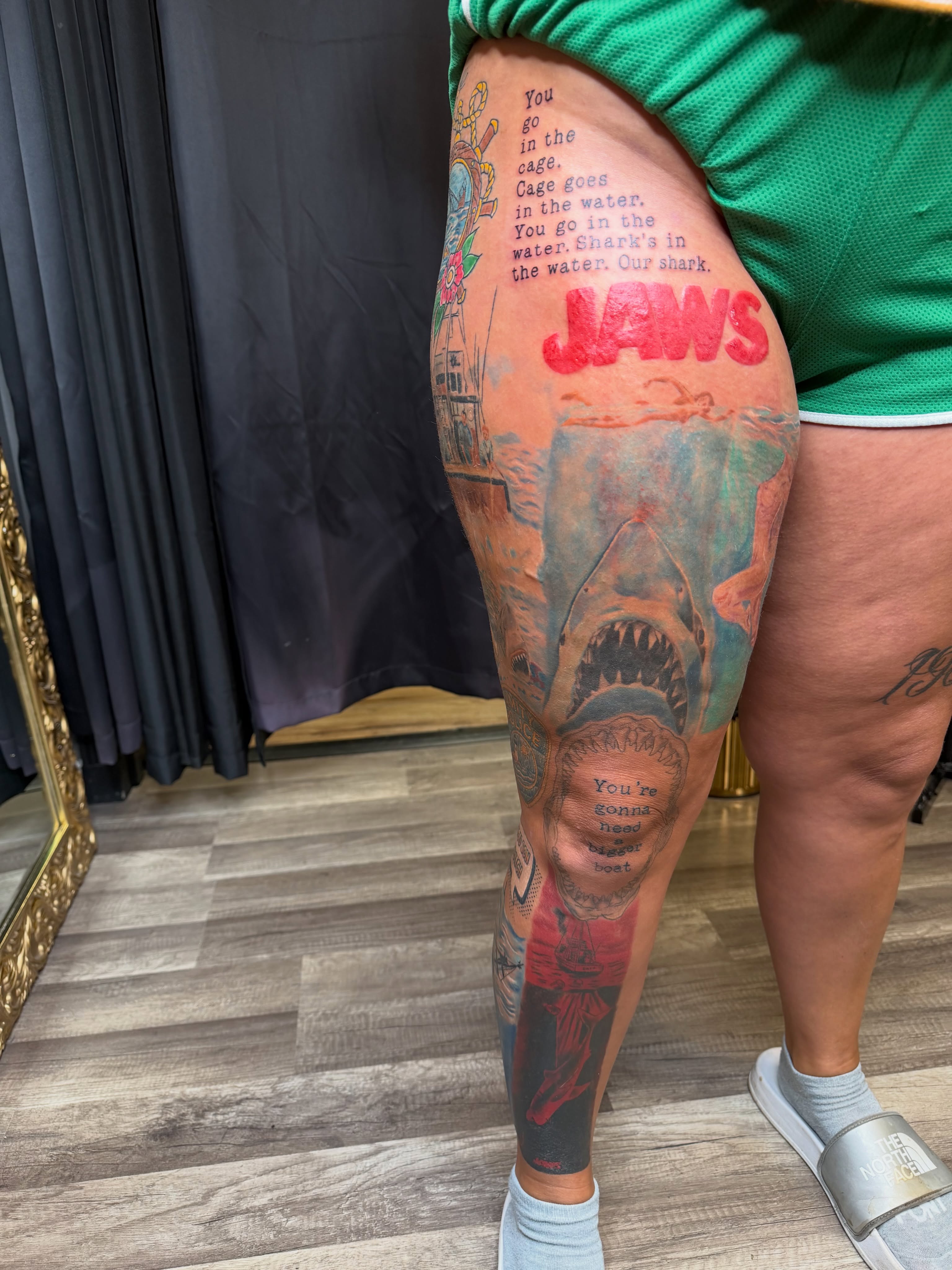 Jaws movie poster realism tattoo on the thigh by Rain David