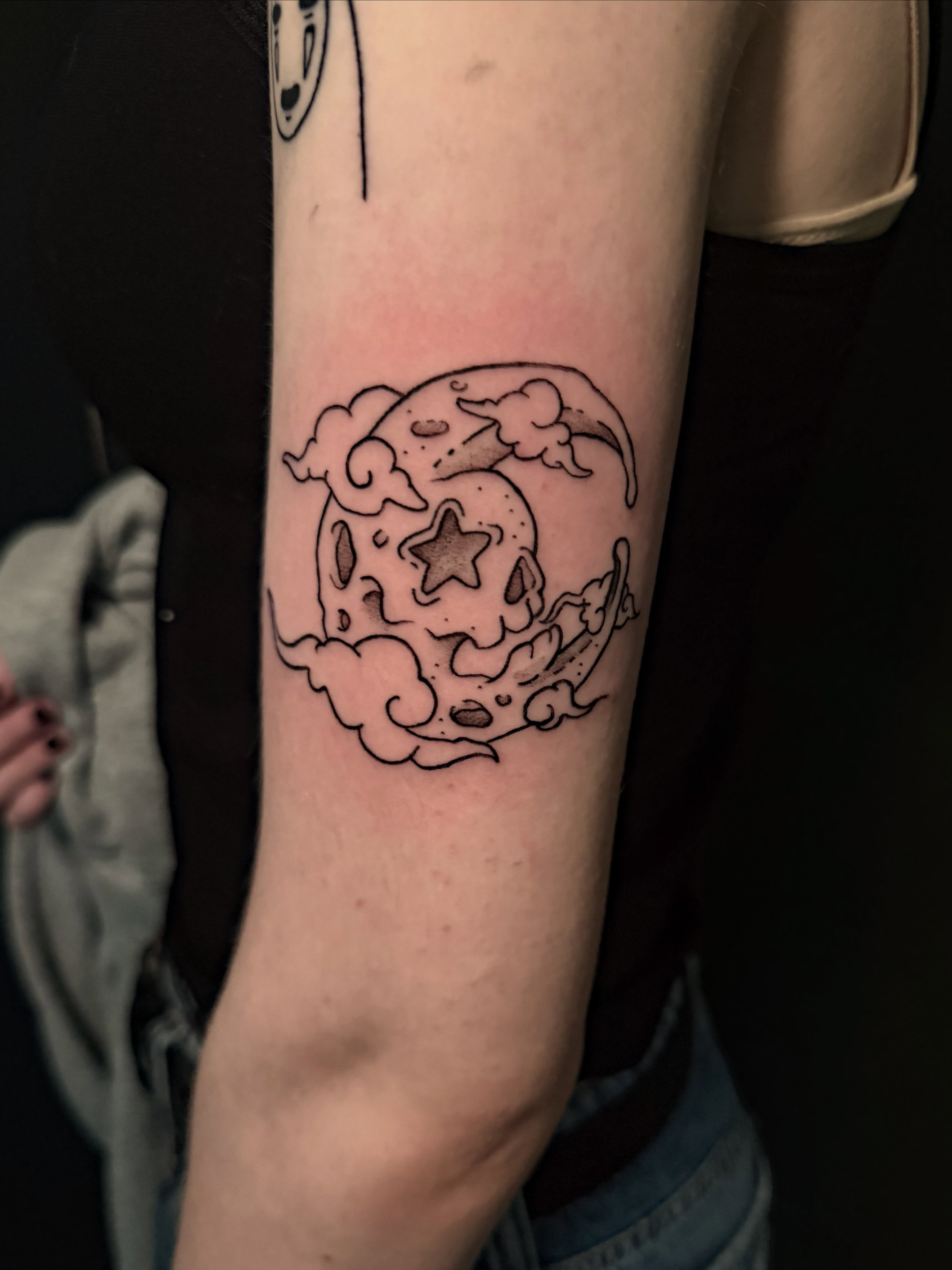 Moon and clouds black and grey tattoo on the forearm by Ivy-Jade Edwards, Memphis, Tennessee