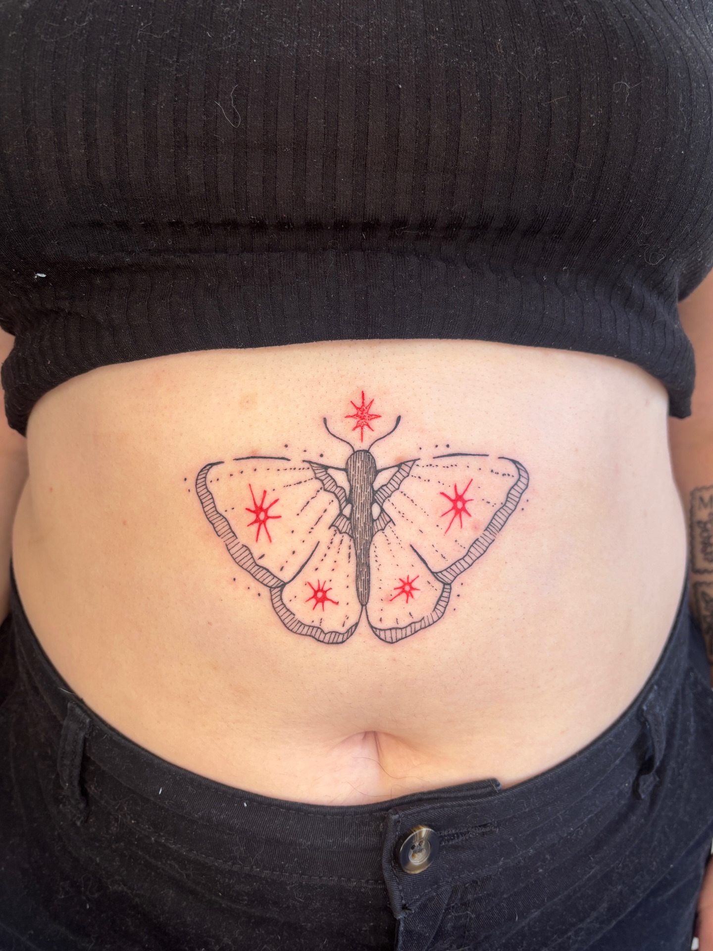 Butterfly dotwork tattoo on the torso by Raye