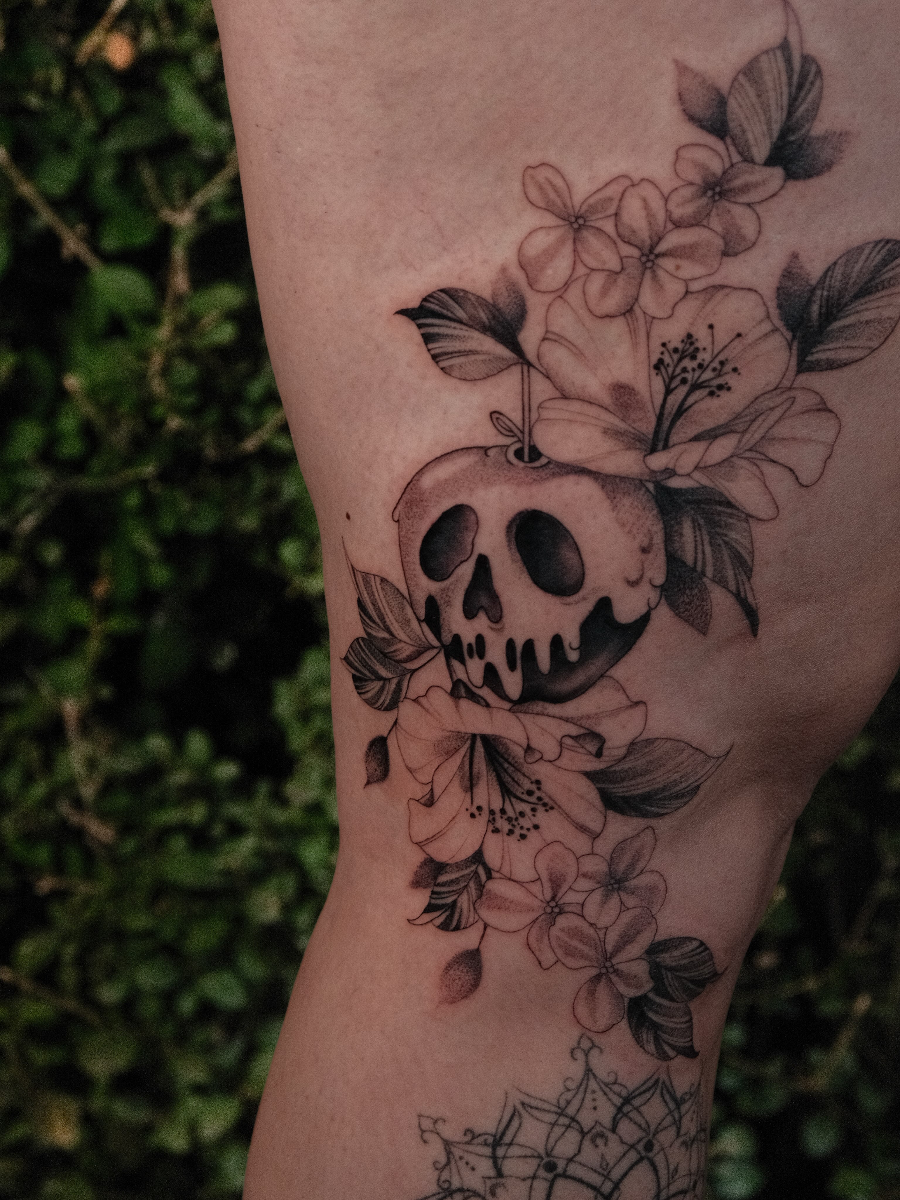 Skull and flowers black and grey tattoo on the forearm by JoeyJazz