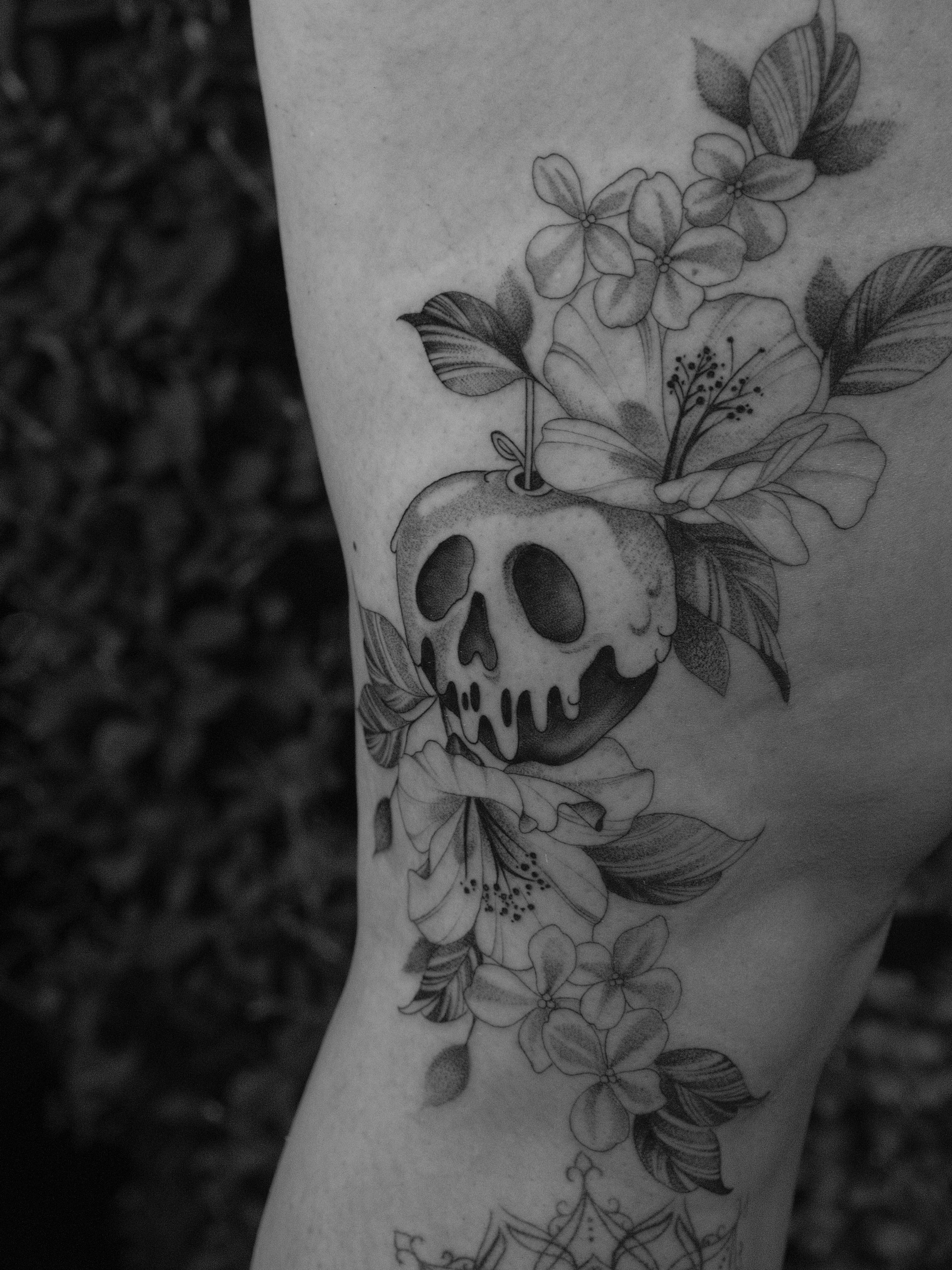 Skull and flowers realism tattoo on the forearm by JoeyJazz