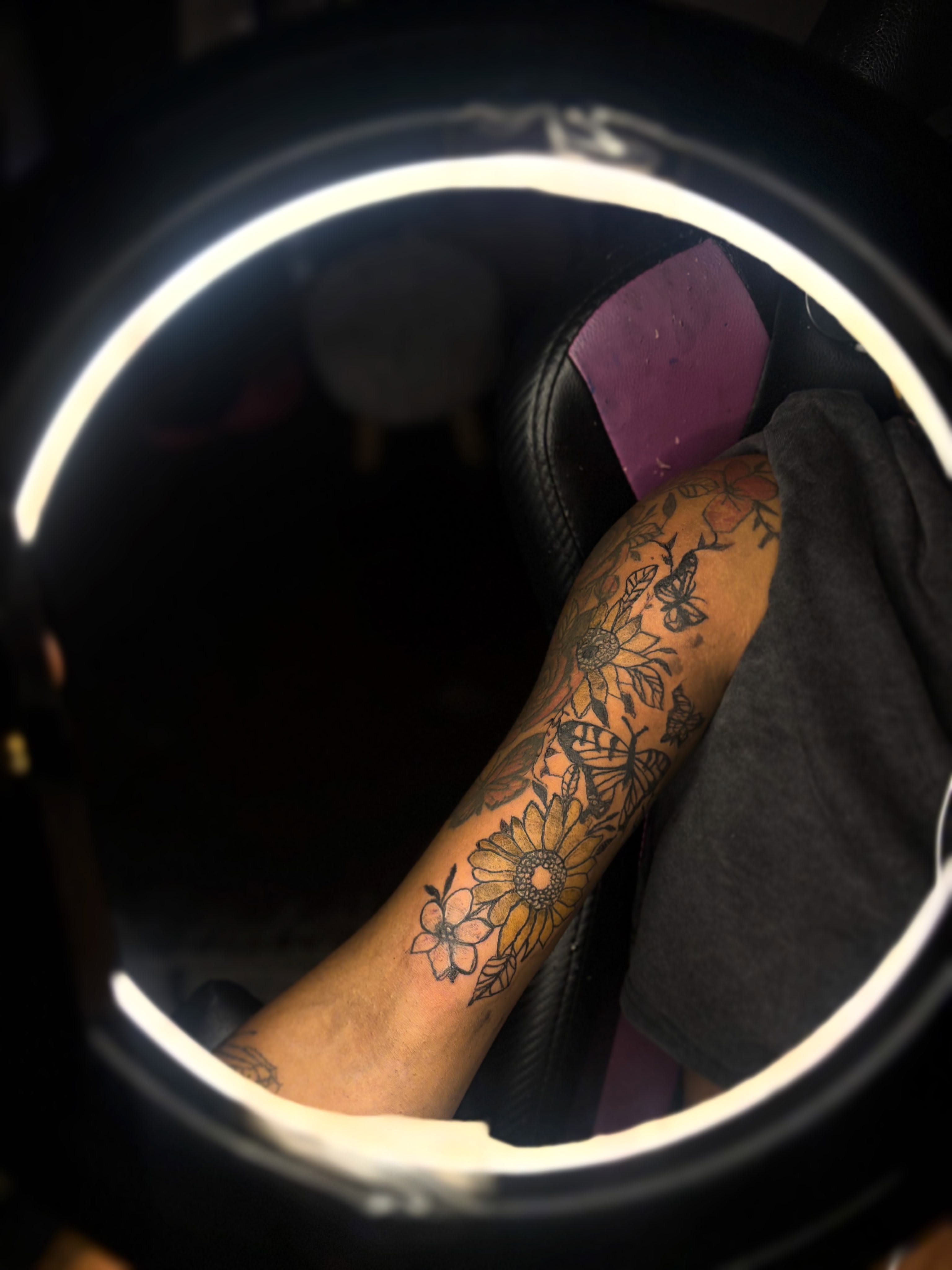 Sunflowers and butterflies American traditional tattoo on the forearm by Winter j